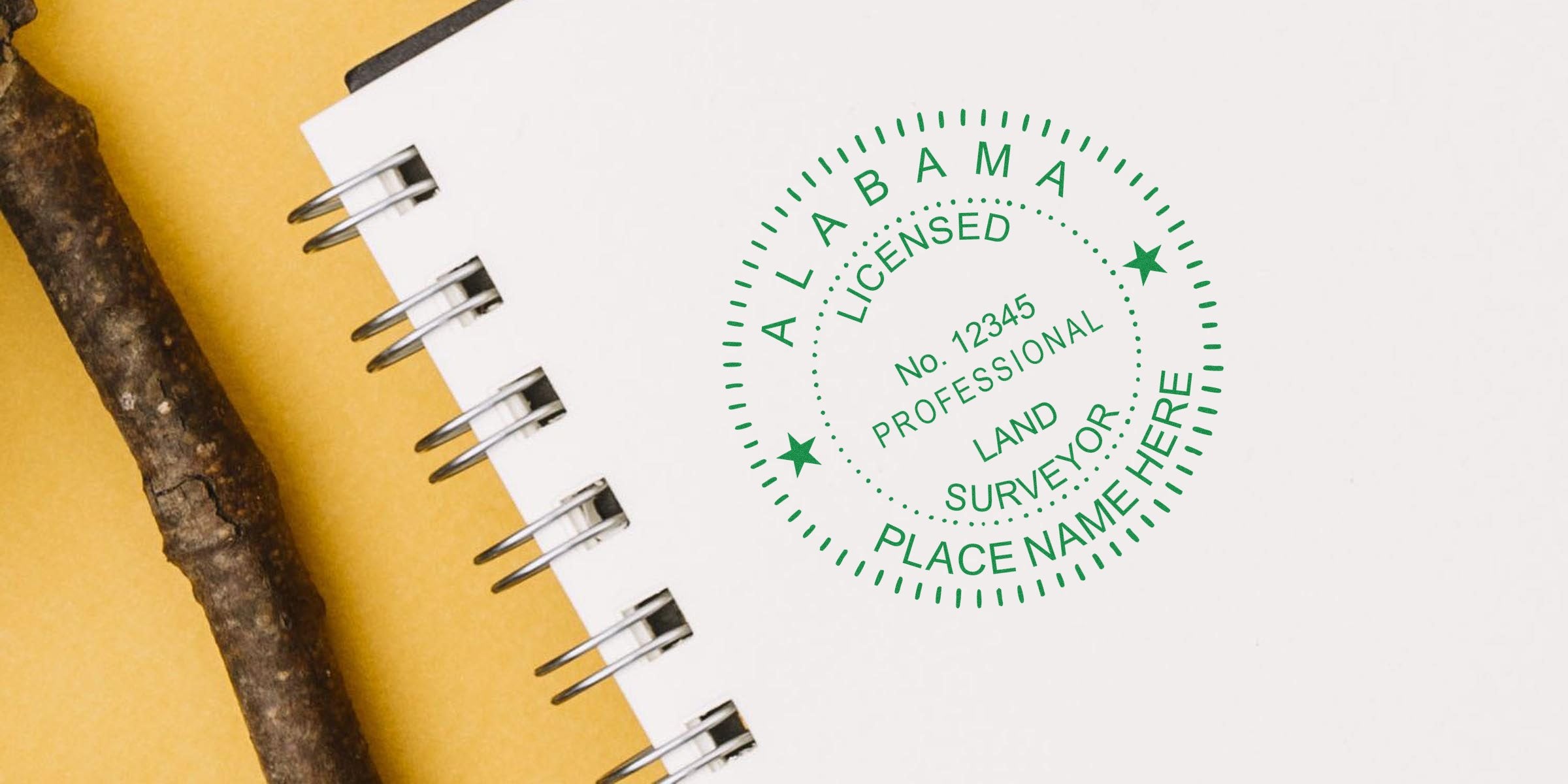 Alabama licensed land surveyor stamp on white spiral notebook with brown stick, set on yellow background, highlighting tips and guidance for choosing an Alabama surveyor seal.