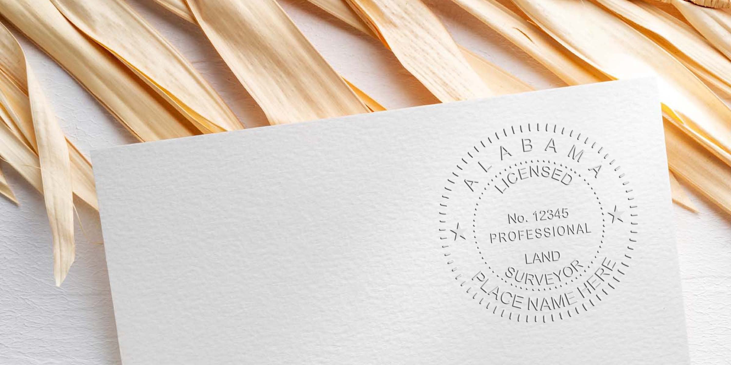 Embossed Alabama land surveyor stamp on white paper with wooden background, symbolizing licensed professional and online land surveyor certification.