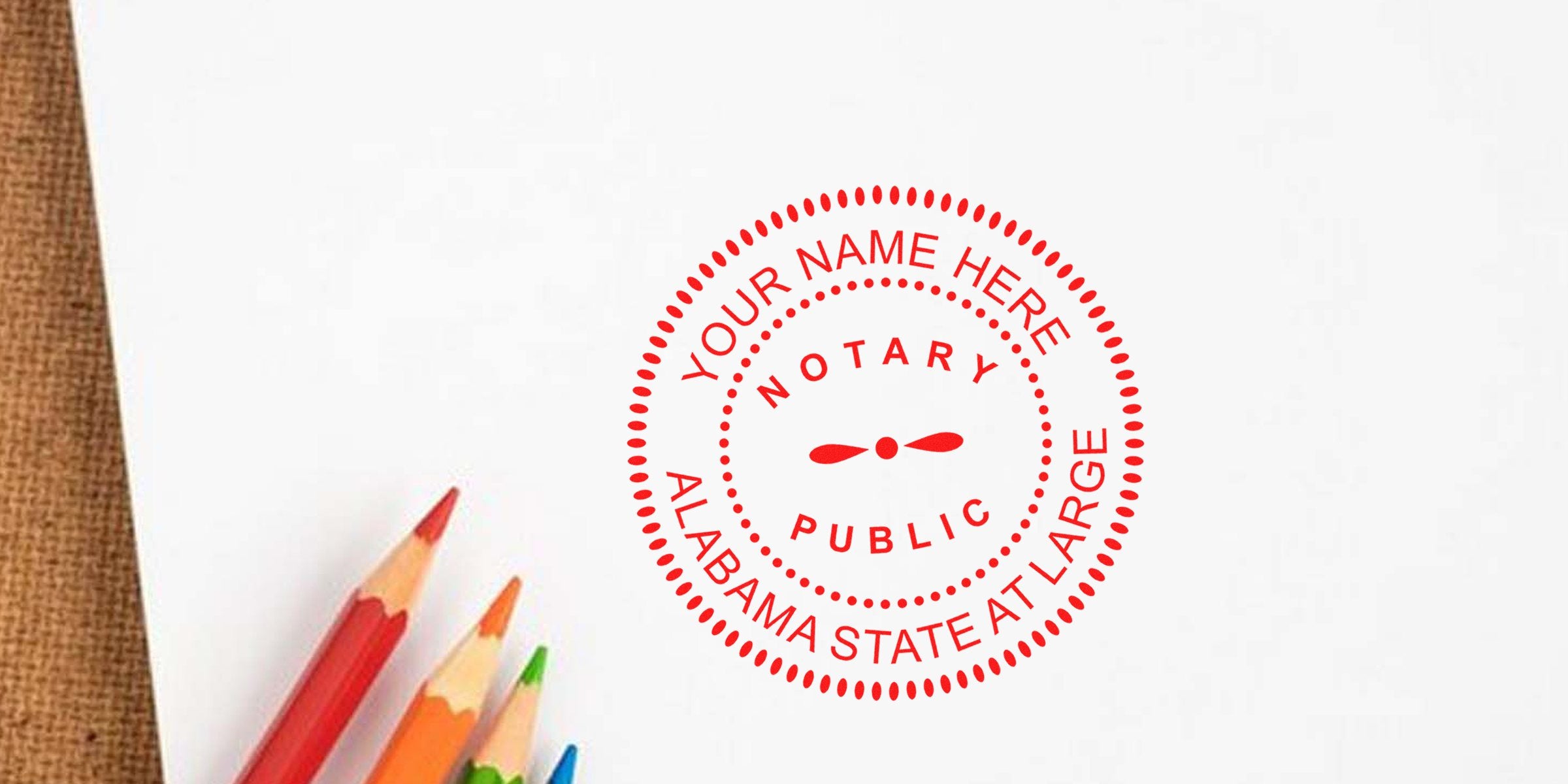 Custom Alabama notary seal stamp in Atlanta, created with colored pencils on white paper, meeting all Alabama notary seal requirements.