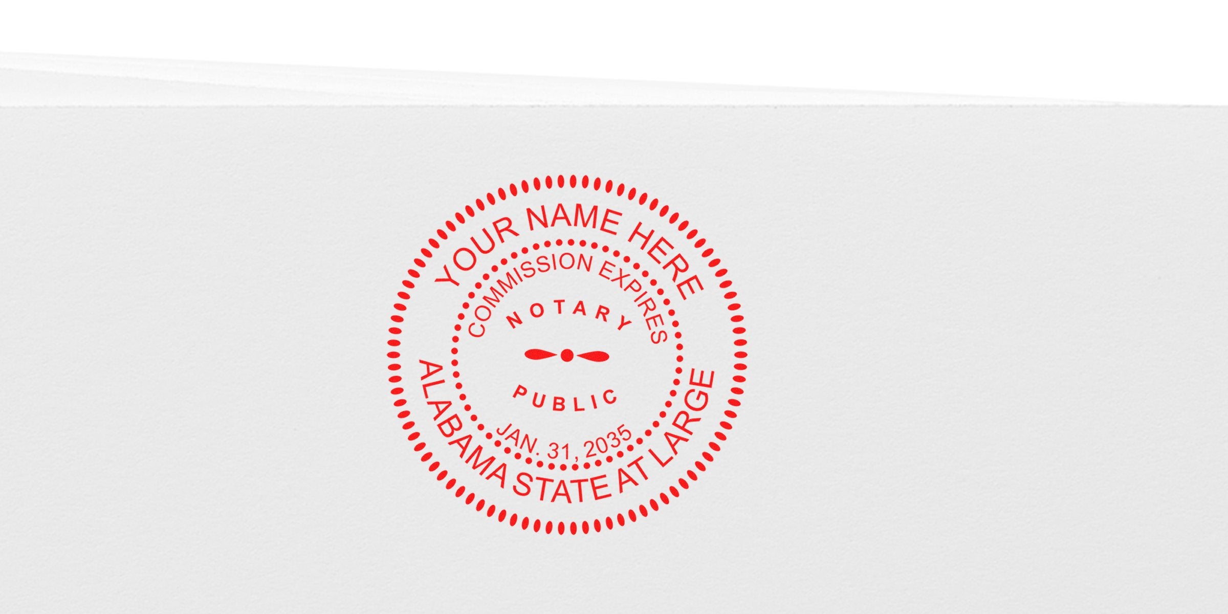 Red Alabama notary stamp on white paper showing commission expiration date, part of the stamp and notary stamp guide for Alabama.