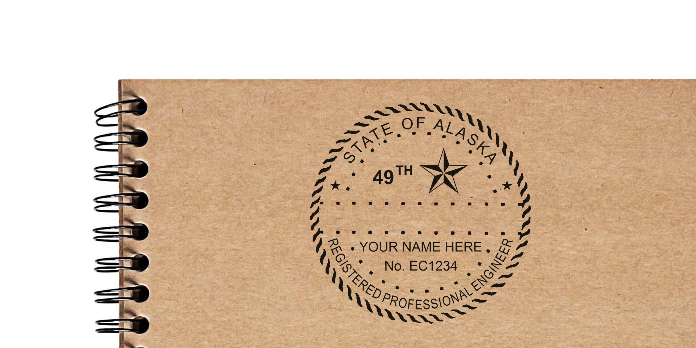 Alaska professional engineer seal stamped on a brown spiral notebook, showing the Alaska engineer stamp process and requirements.