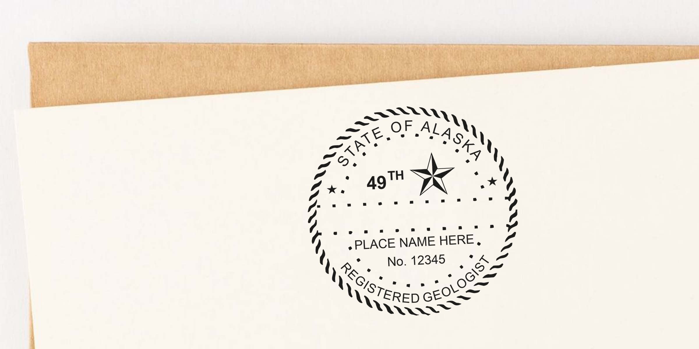 Alaska registered geologist seal on white paper with brown envelope, made by a custom stamp maker specializing in Alaska geologist seals.