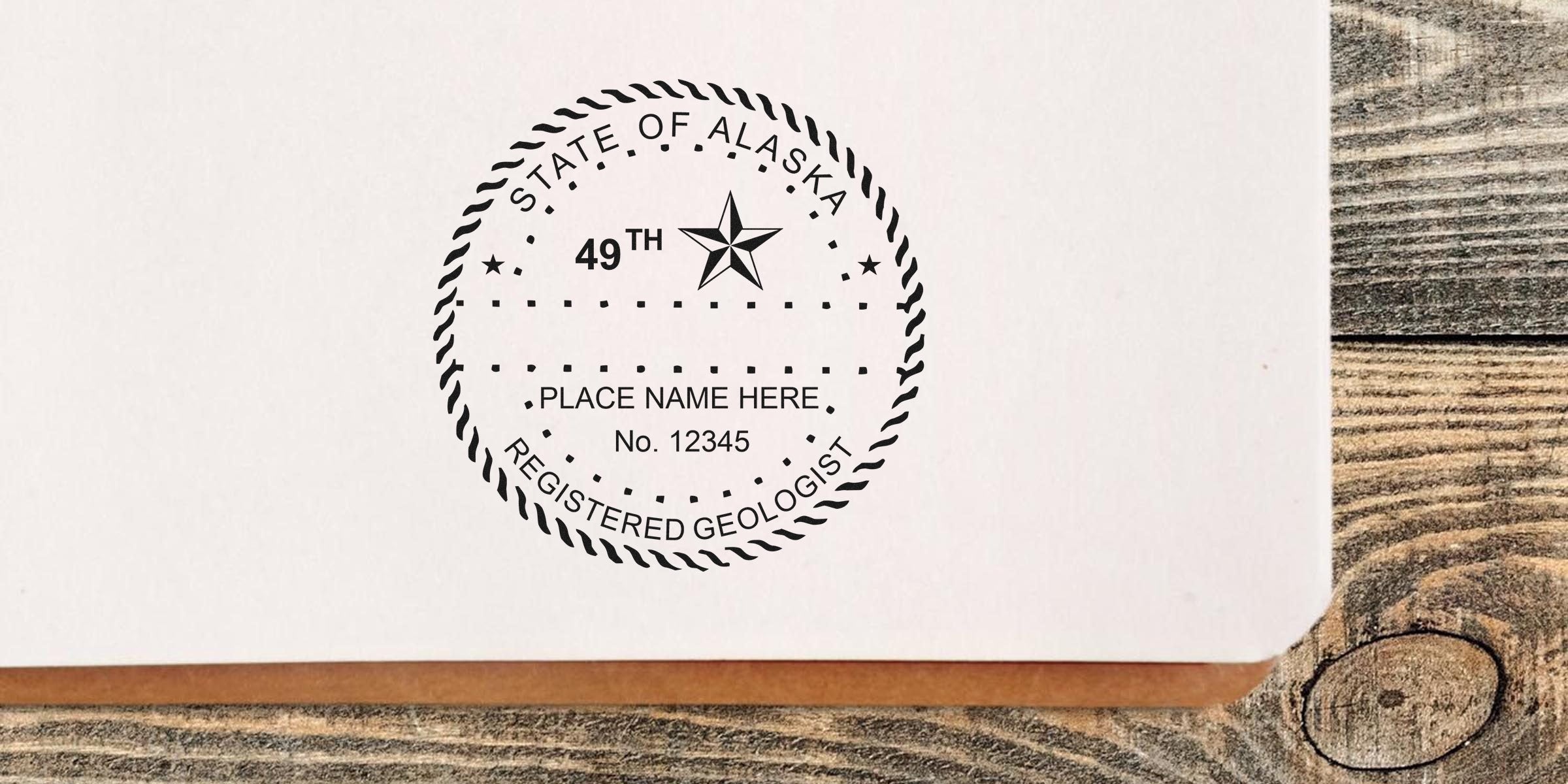 Alaska Geologist Stamp Replacement with State of Alaska registered geologist stamp on white paper, set against a wooden background.