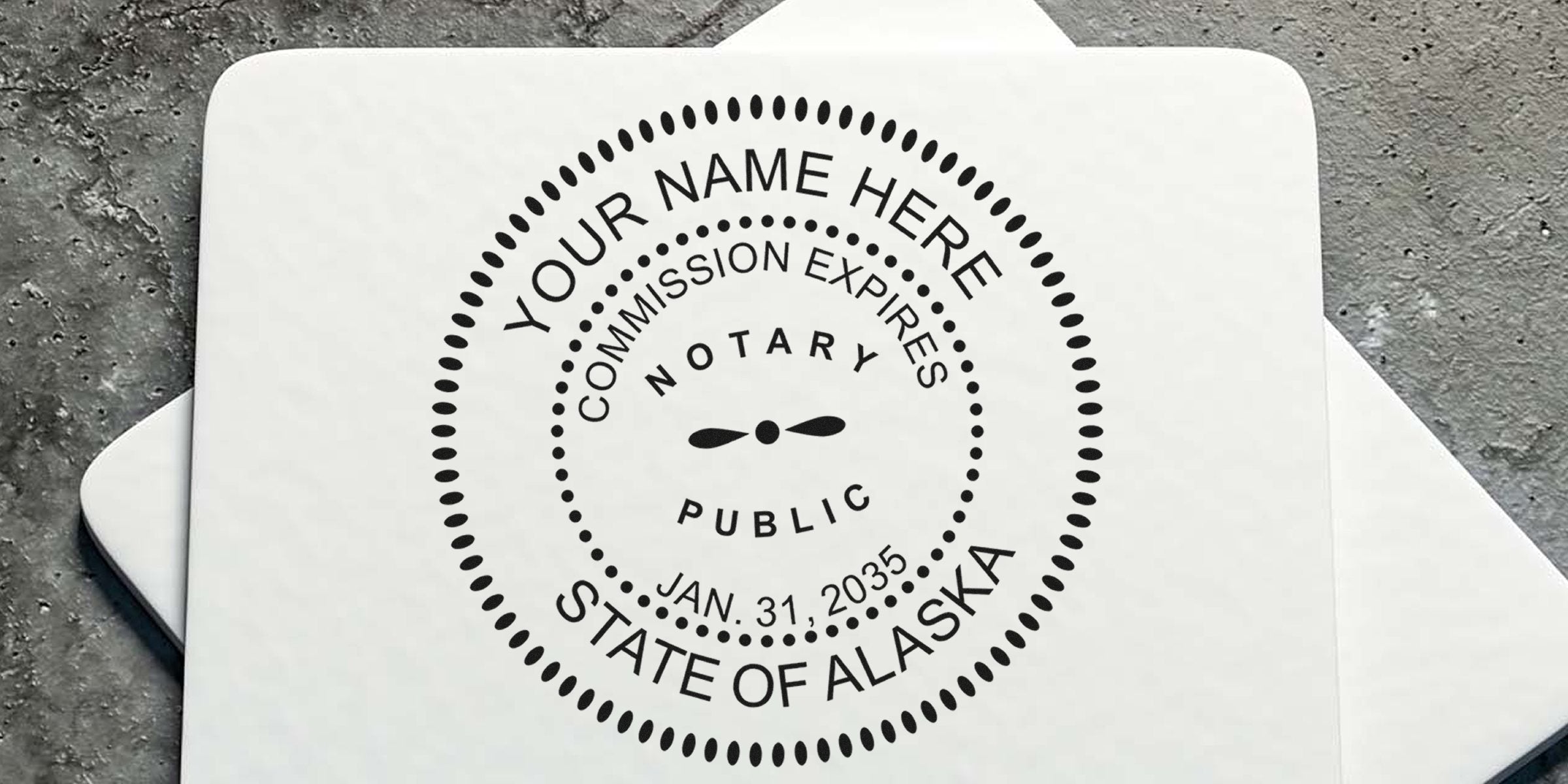 Alaska notary public stamp with commission expiration date on textured background, emphasizing Alaska notary stamp renewal and tips for renewing your notary commission.