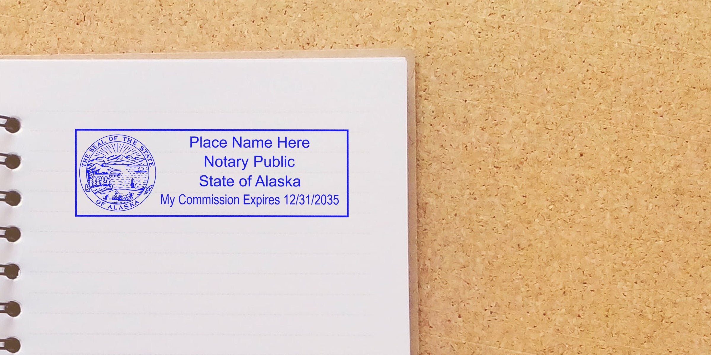 Alaska notary public with a reliable notary stamp on a notebook page displaying the commission expiration date.