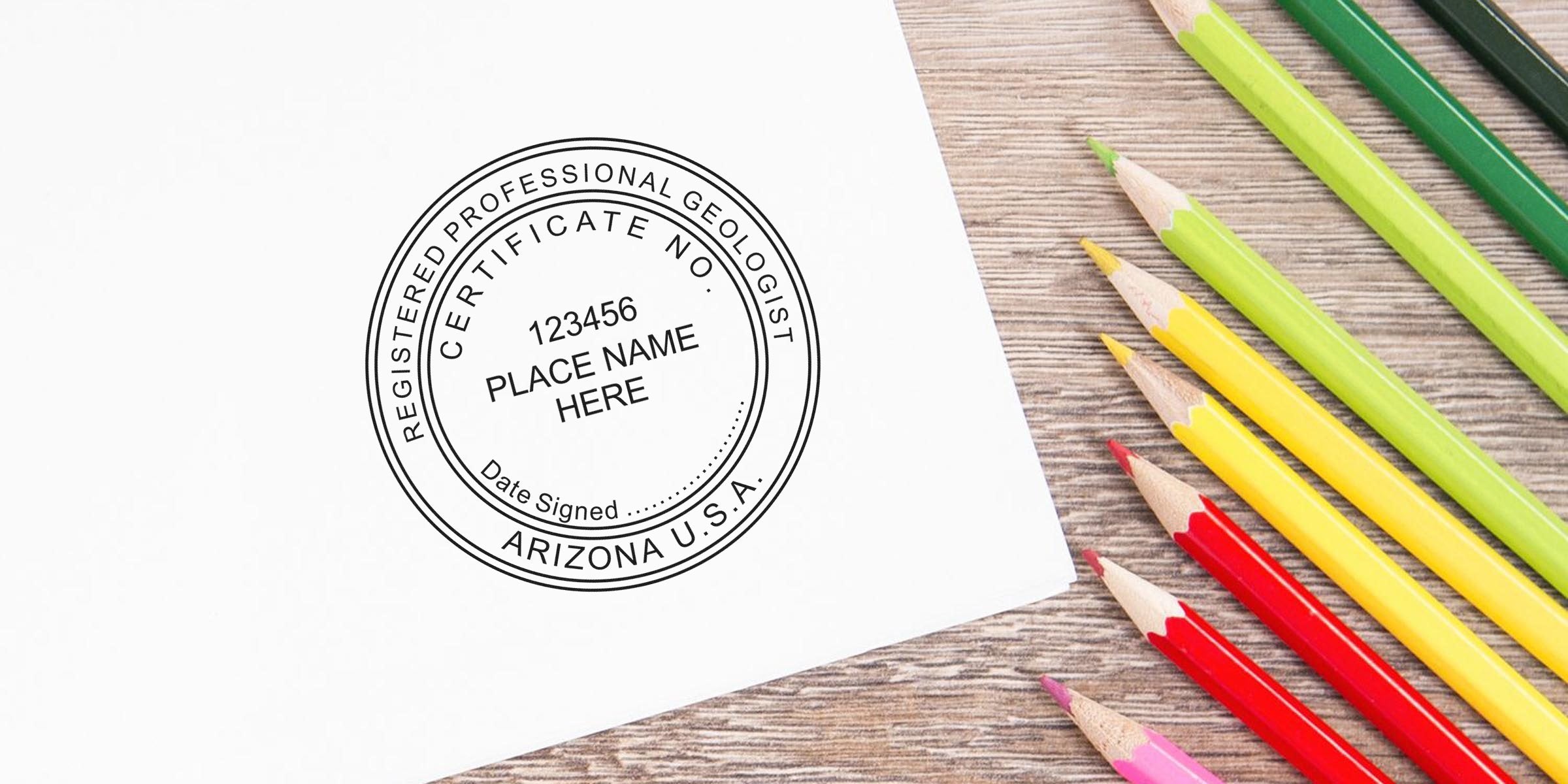 Arizona Geologist Seal on white paper with colored pencils on a wooden desk, symbolizing Professional Geologist Certification.