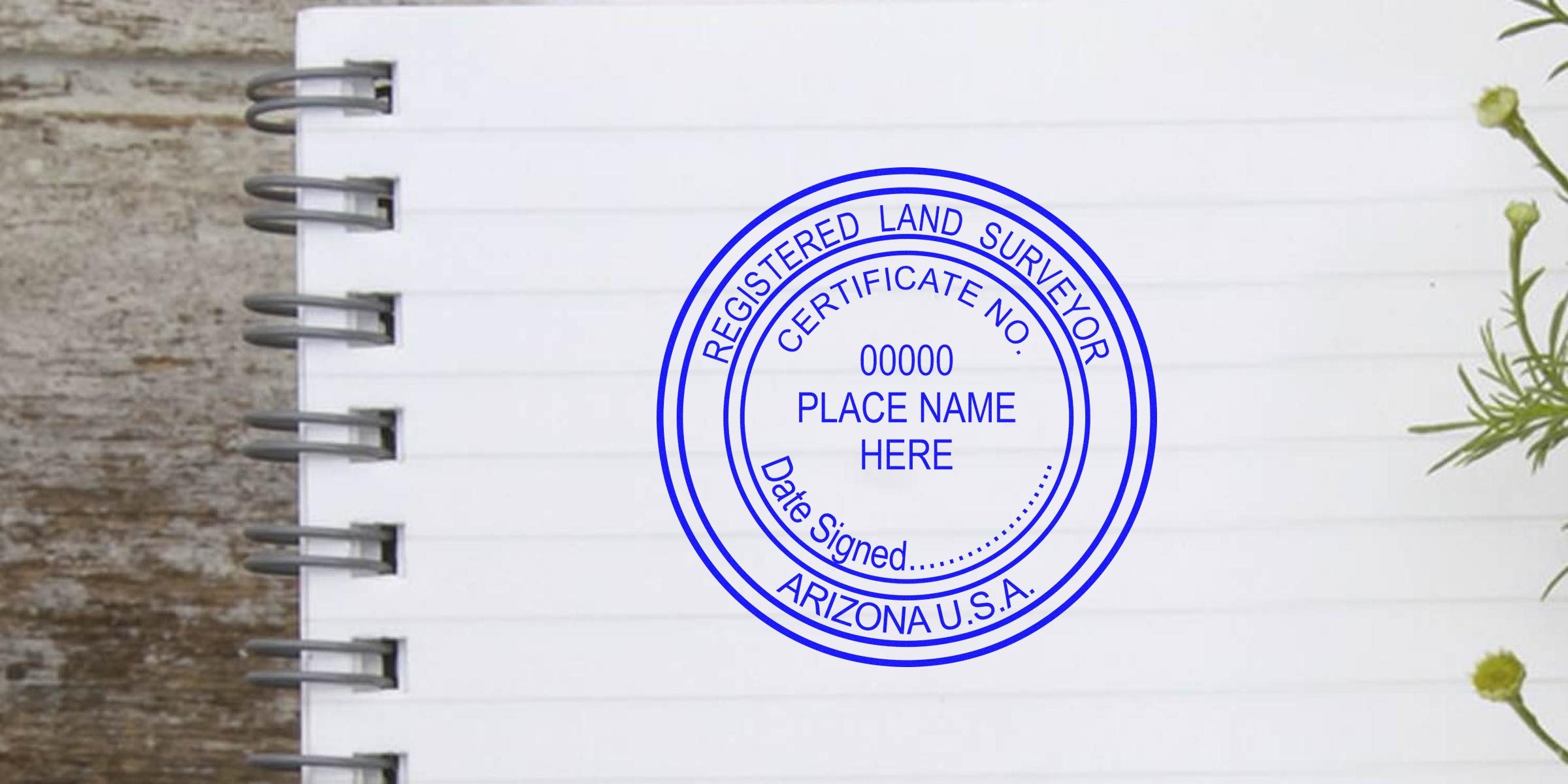 Registered land surveyor stamp with Arizona land surveyor seal on a notebook page for Arizona land surveying services.