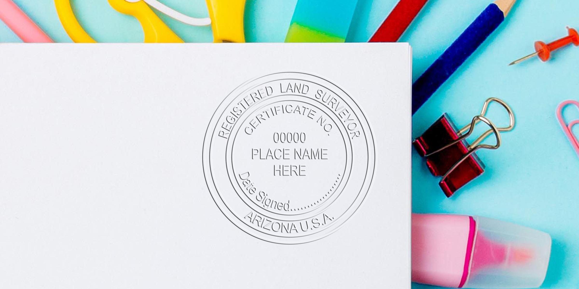 Arizona land surveyor stamp on white paper with office supplies, certified survey document, and surveyor stamp order checklist.