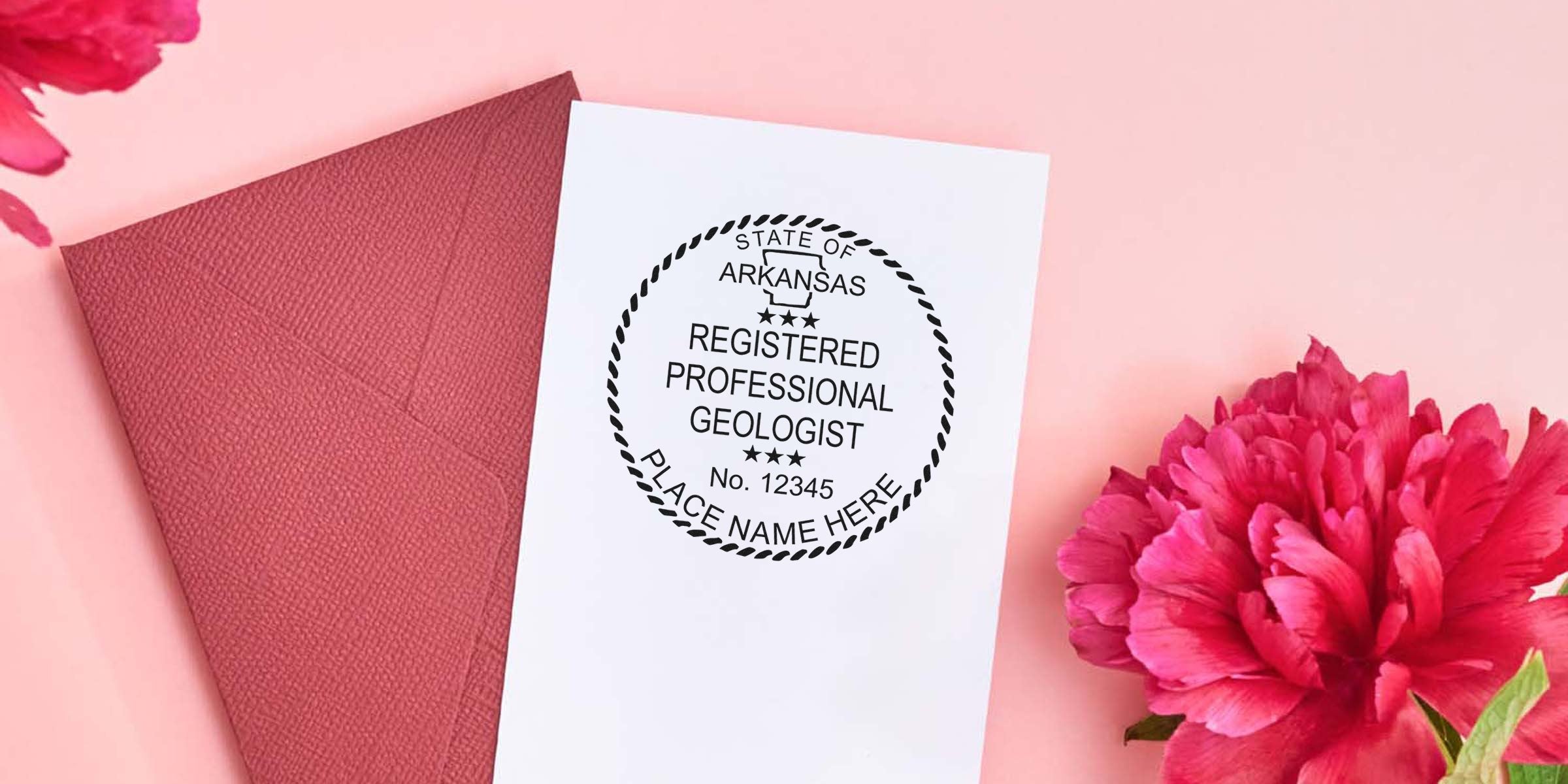 Arkansas Geologist Stamp on white paper with red envelope and pink flowers, featuring Geologist Stamp Arkansas and Arkansas Geologist Licensing Requirements.