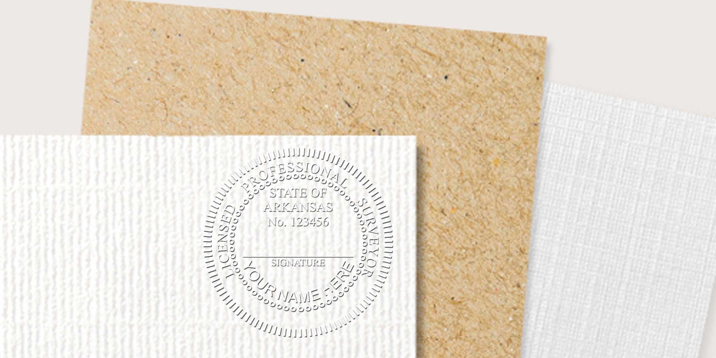 Embossed seal of a licensed Arkansas land surveyor on textured paper, showing stamp tips for certification.