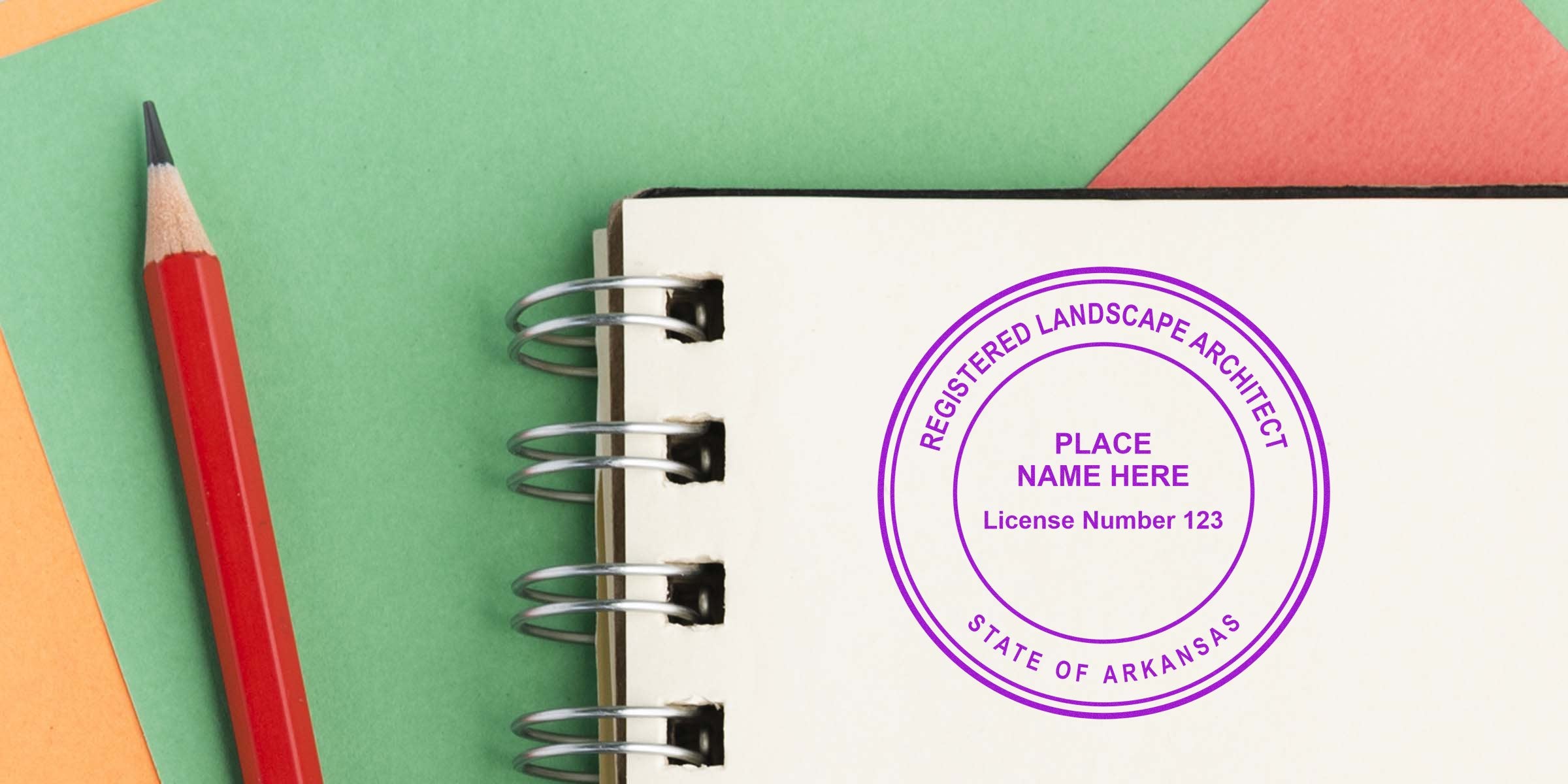 Registered landscape architect stamp on notebook with red pencil on colorful background, showing Arkansas landscape architect license requirements and stamp for verification.