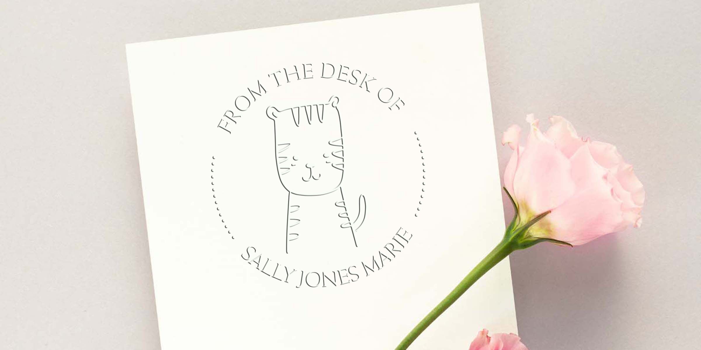 Custom cat stationery card with “From the Desk of Sally Jones Marie” text, minimalist line art cat logo, and a pink rose on a soft neutral background