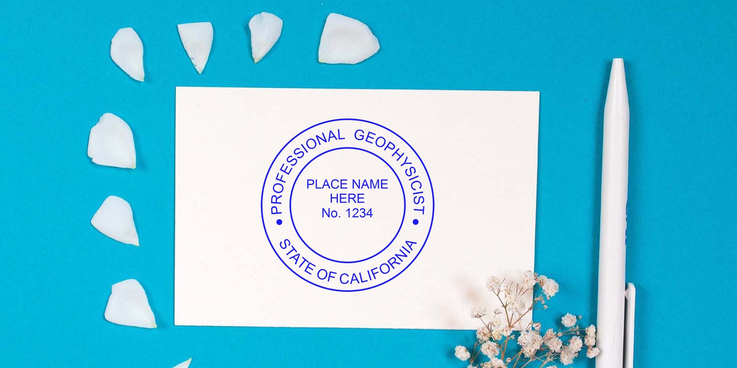 California geologist seal with professional geophysicist stamp, white pen, and flower petals on blue background, highlighting geologist seal details.