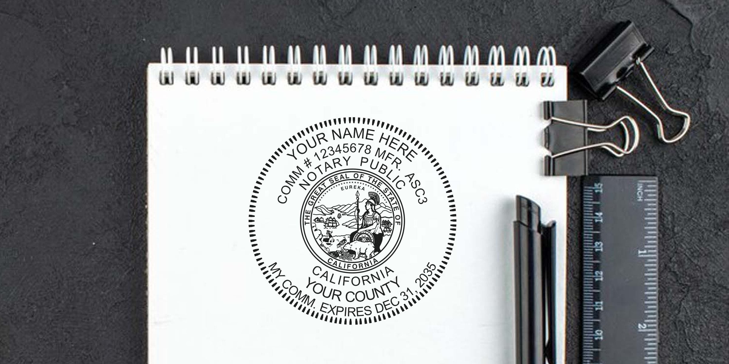 California Notary Public seal on white notebook with office supplies, showing official notary stamp use per Notary Seal Guidelines for legal documents.