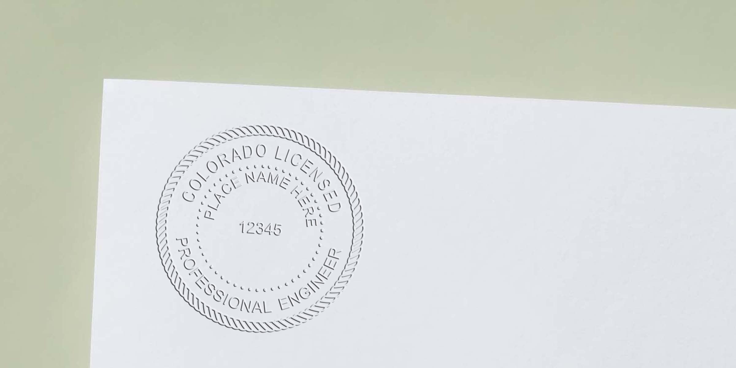 Embossed Colorado engineer seal on white paper for certification, complying with engineering seal standards.