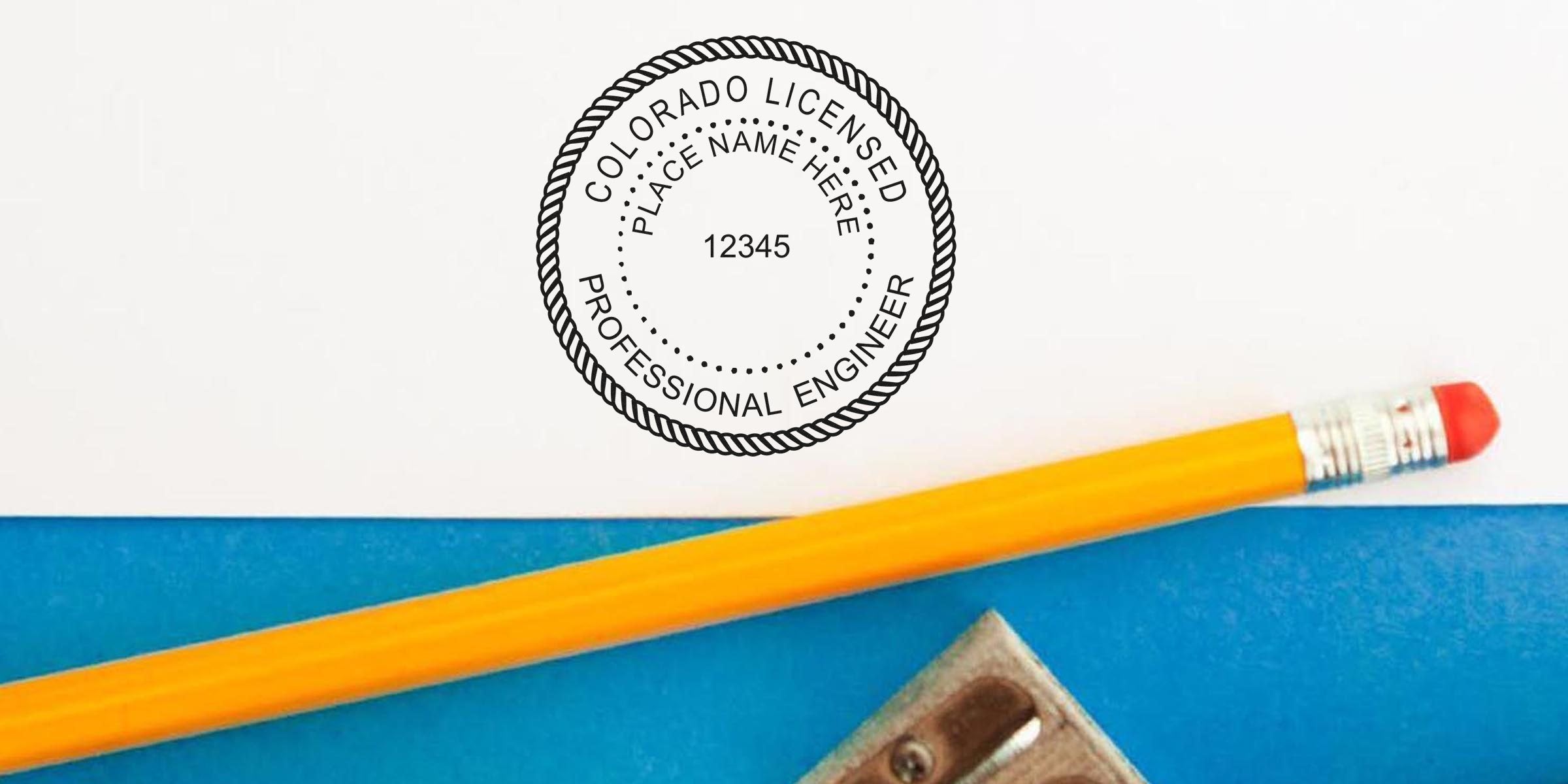 Colorado engineer stamp on paper with pencil and sharpener, featuring a licensed professional engineer stamp. Buy your Colorado engineer stamp online today.