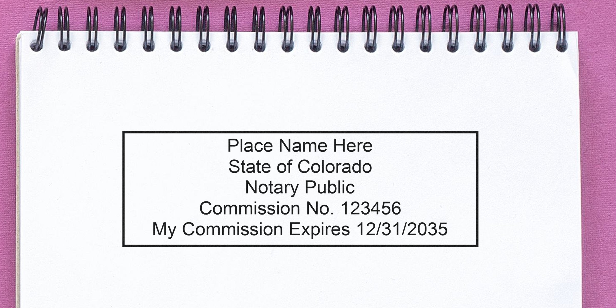 Colorado notary public stamp on white notebook showing expiration date, highlighting the size and dimensions of the Colorado notary seal.