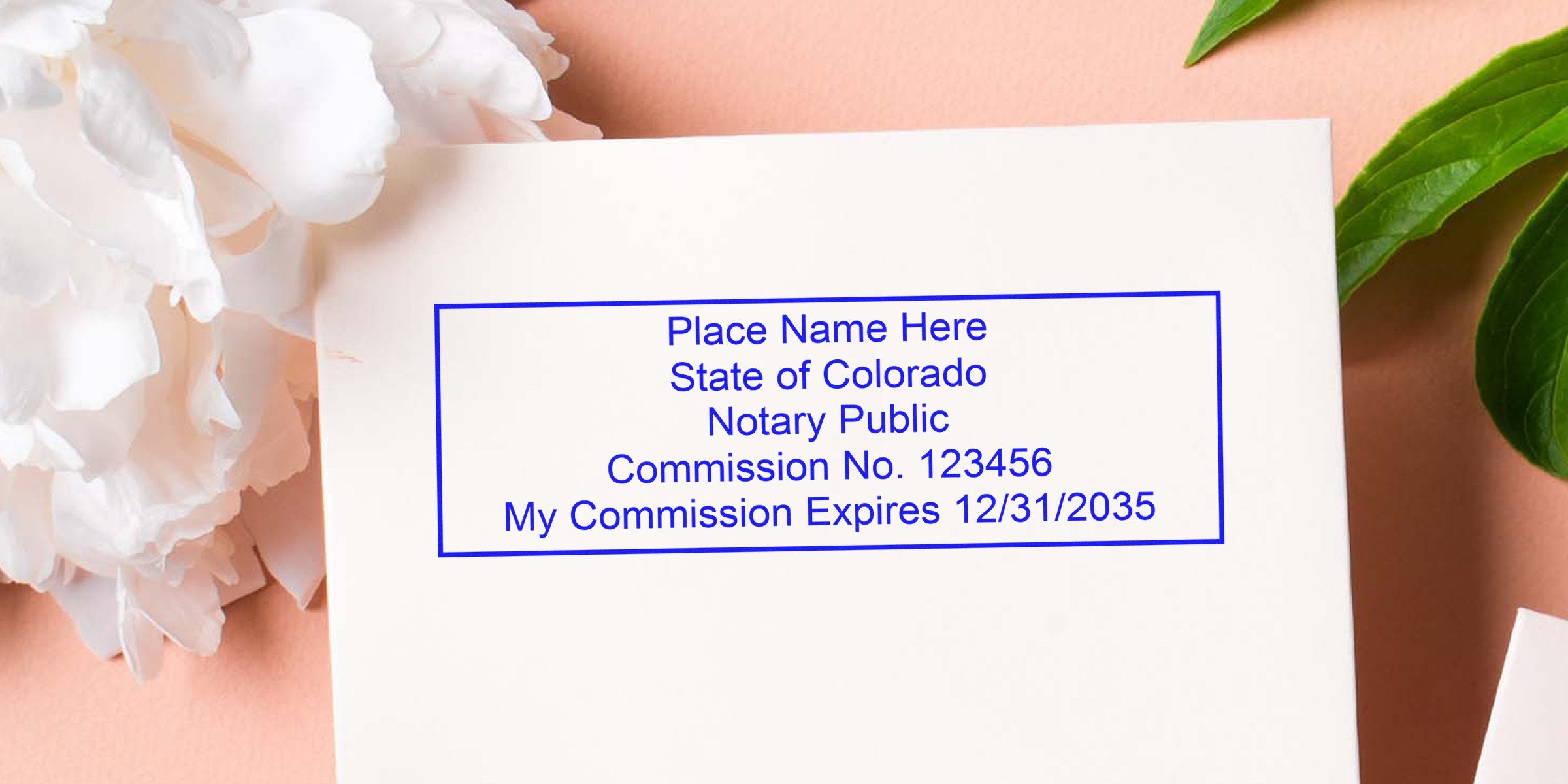 Notary Seal Colorado stamp on white paper with commission number and expiration date, framed by flowers and green leaves, highlighting the Best Notary Deals.