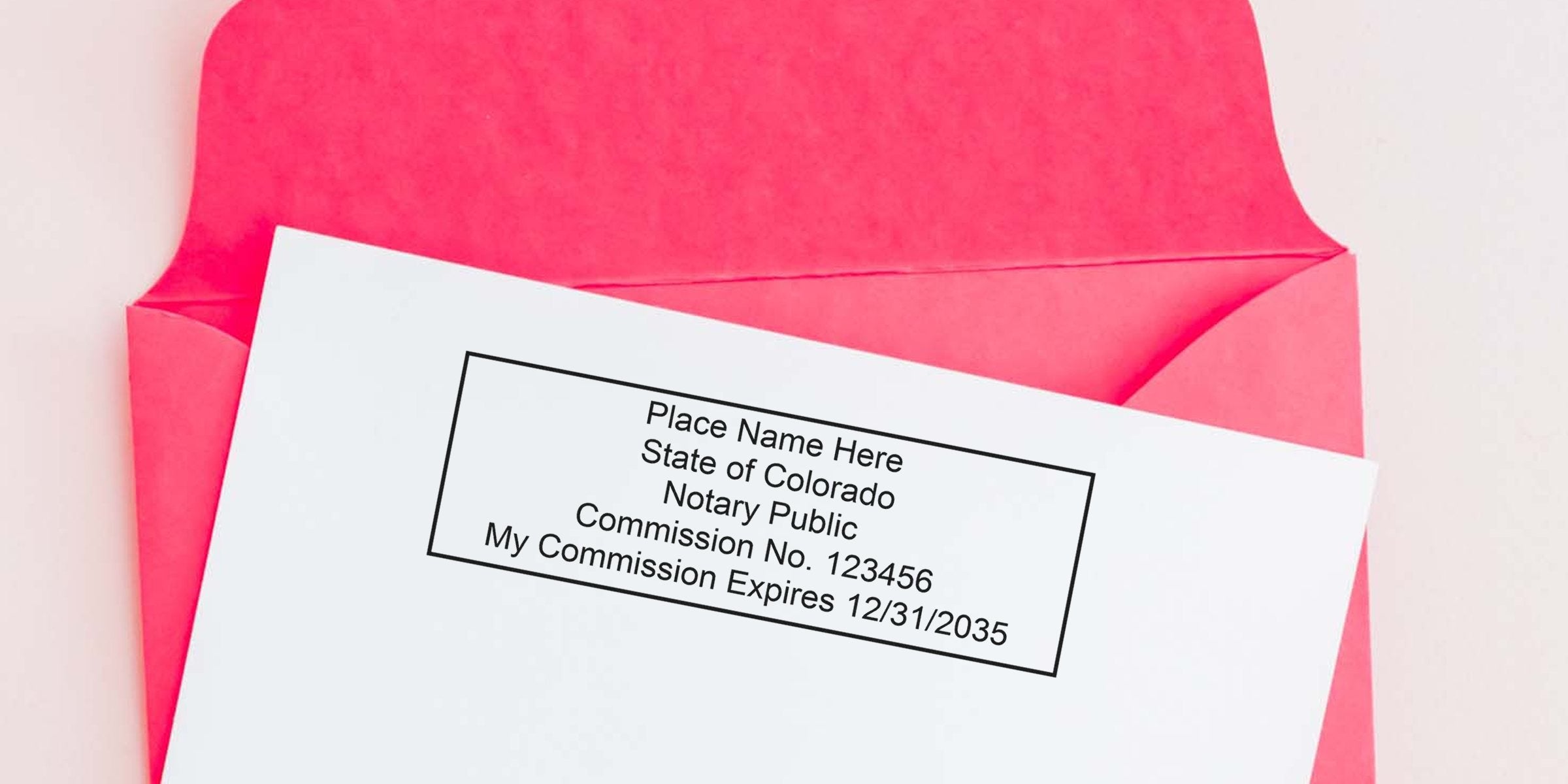 Colorado notary public commission certificate in a red envelope with affordable notary tools and supplies.