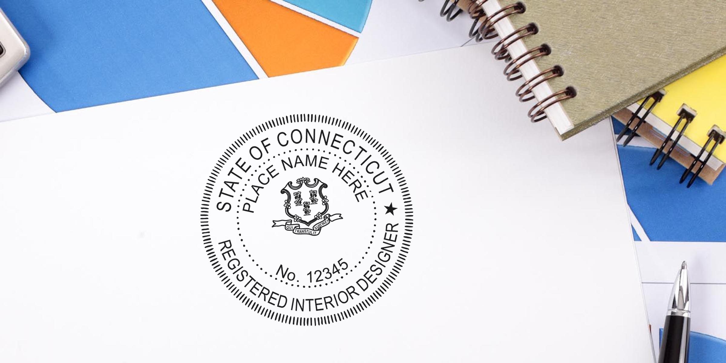 Connecticut interior designer seal on white paper with office supplies, highlighting stamp costs and tips to save on designer stamp fees.