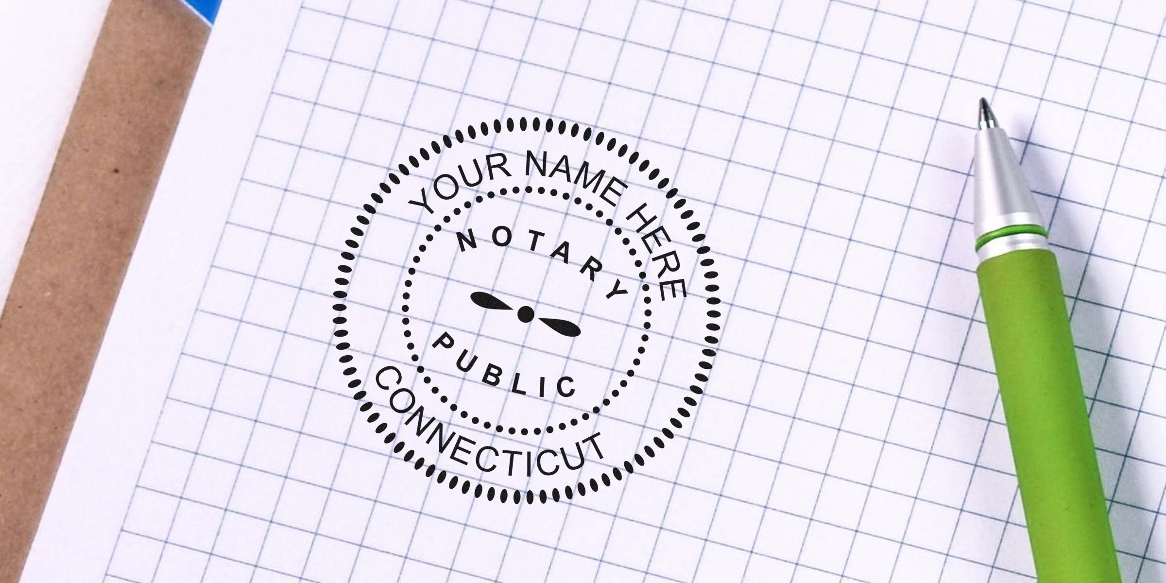 Custom Connecticut Notary Seal stamp on graph paper with green pen, showcasing official document benefits.