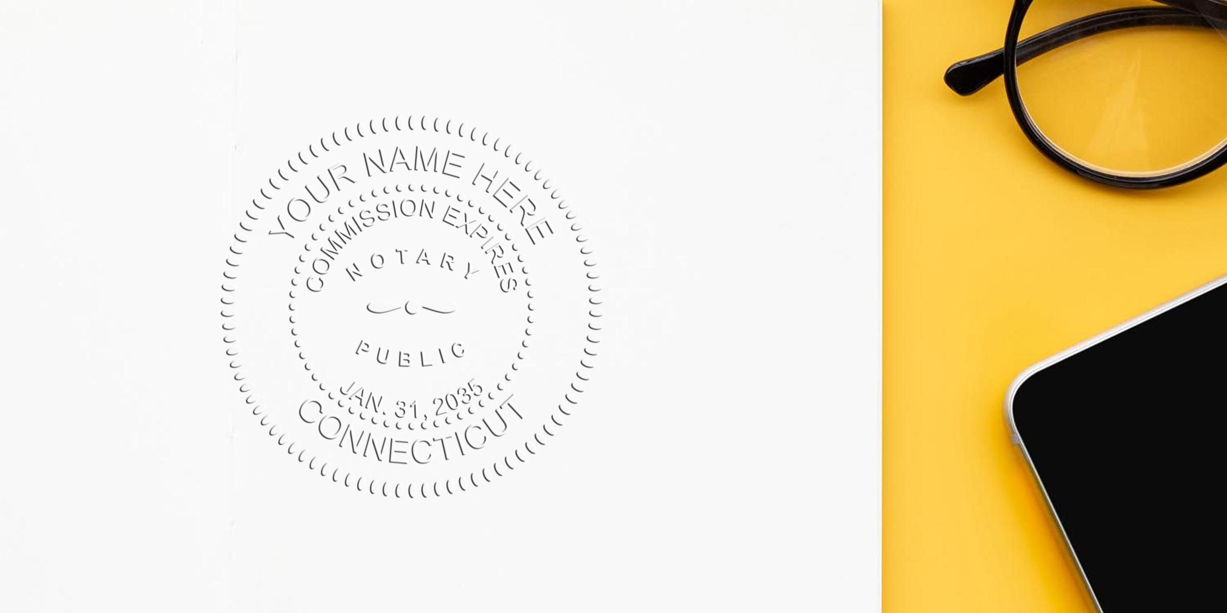 Connecticut notary seal on white paper with glasses and smartphone on yellow background. Notary commission expires Jan 31, 2035. Includes tips for choosing a notary seal.