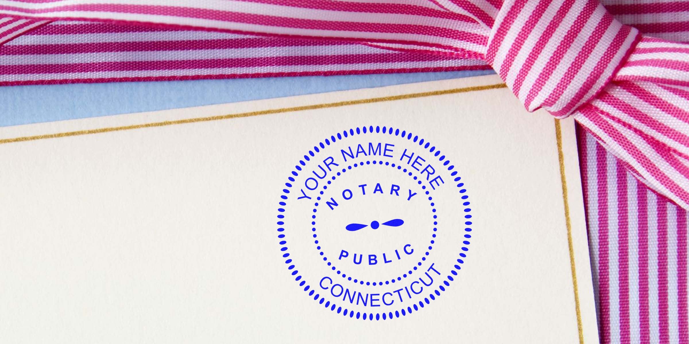 Connecticut notary stamp on certificate with pink striped ribbon, showing official Connecticut notary seal per state notary stamp law.