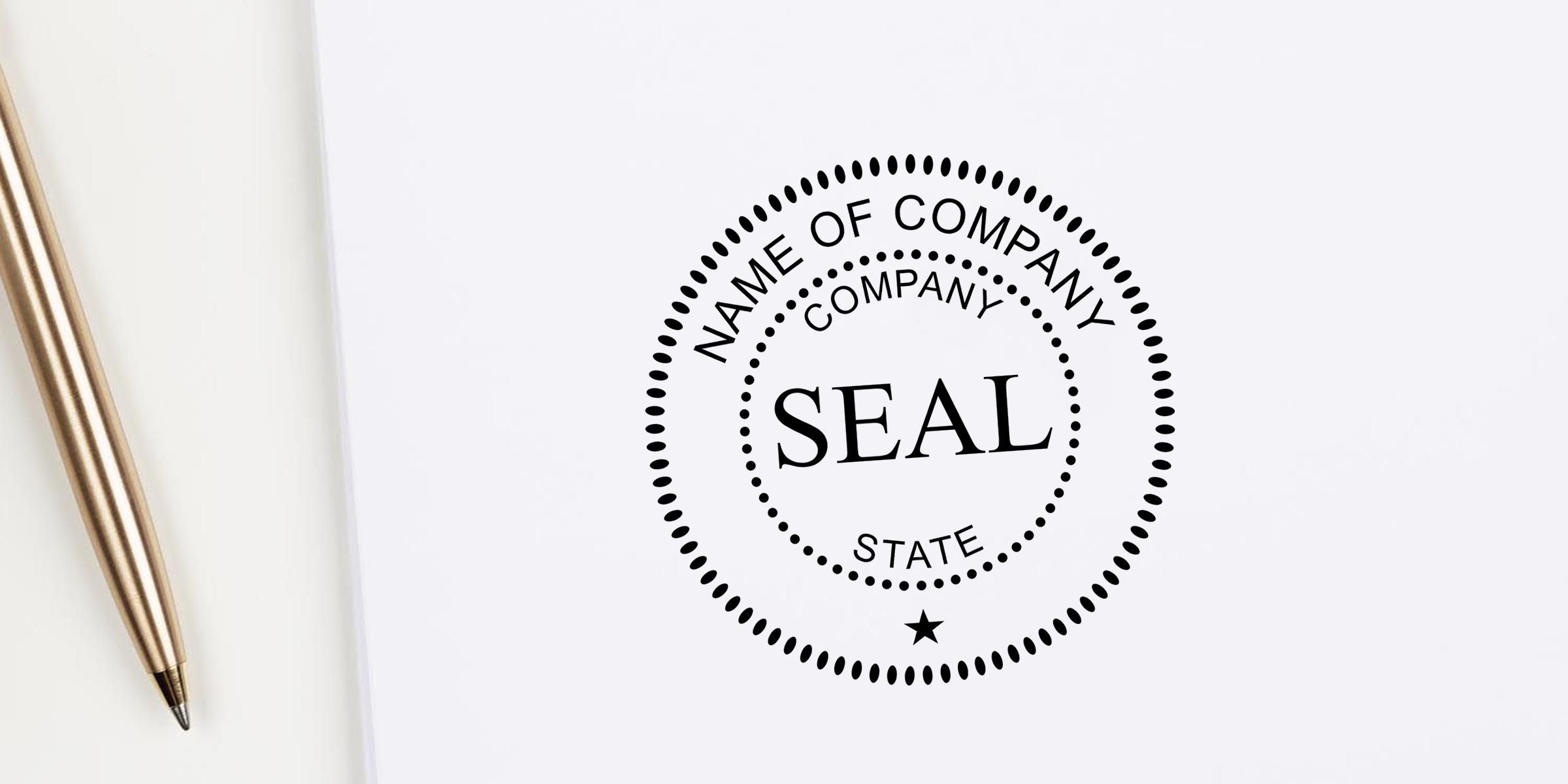 Custom company seal stamp template on white paper beside a gold pen