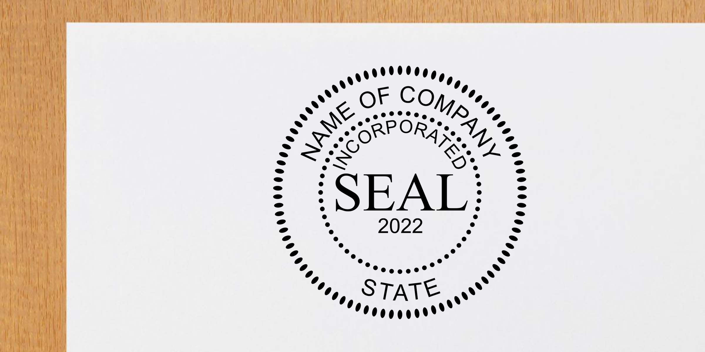 Corporate seal stamp reading “Name of Company Incorporated Seal 2022 State” printed on white paper on a wooden desk background