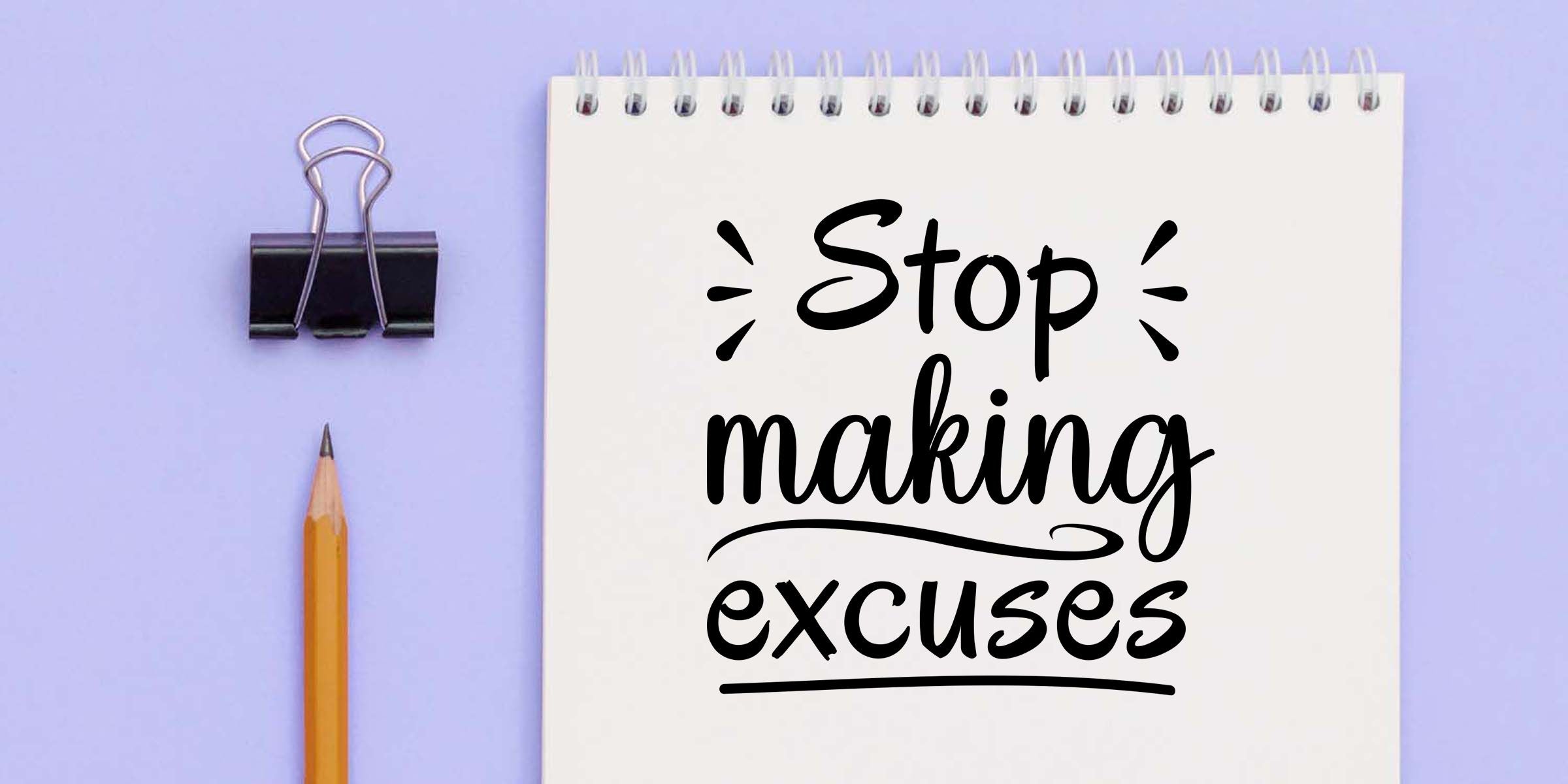 Notepad with handwritten “Stop making excuses” motivational quote, pencil and binder clip on a lavender background