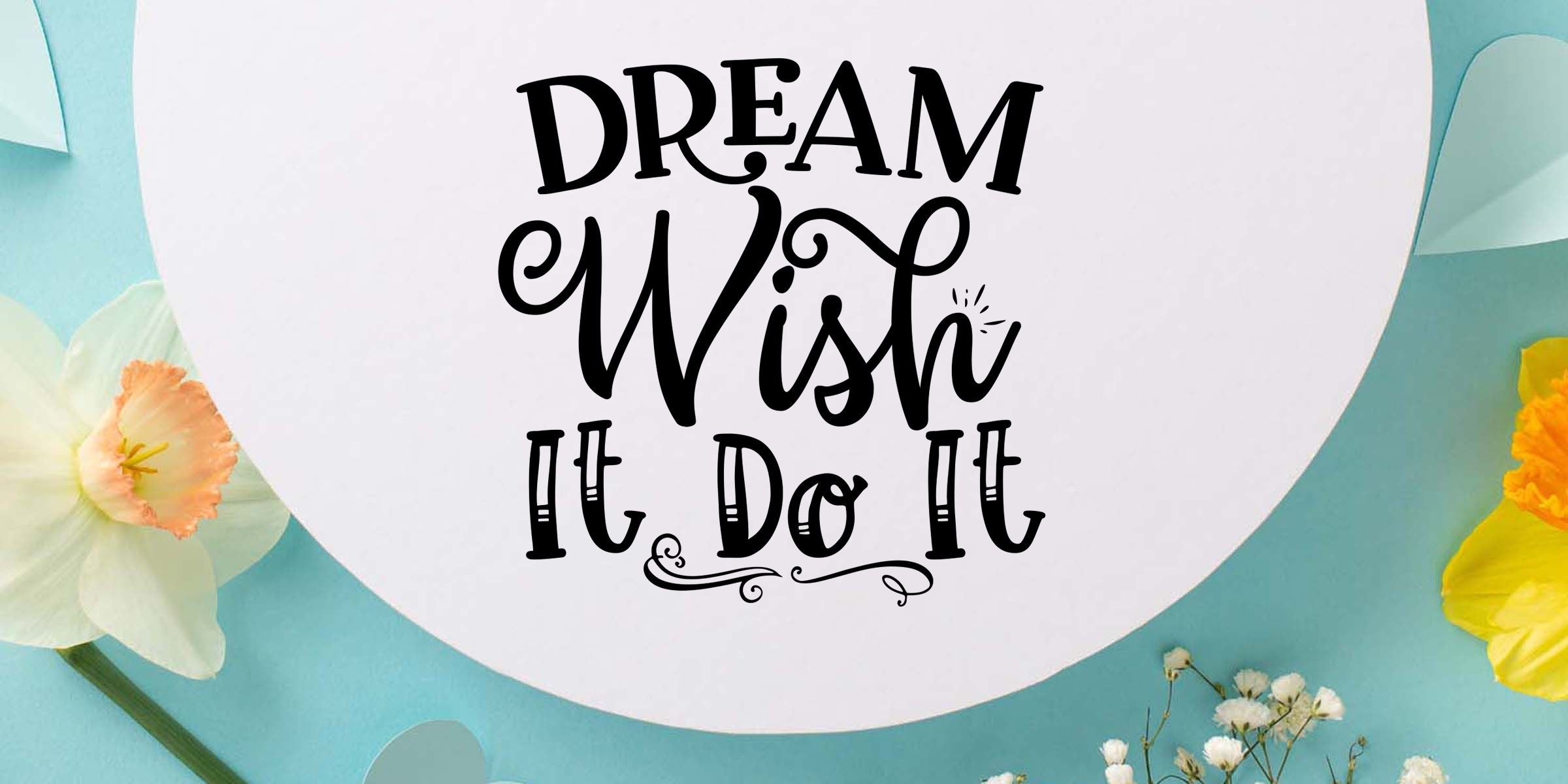Dream Wish It Do It quote on a white circular backdrop with pastel flowers and a light blue floral background, inspirational typography wall art design