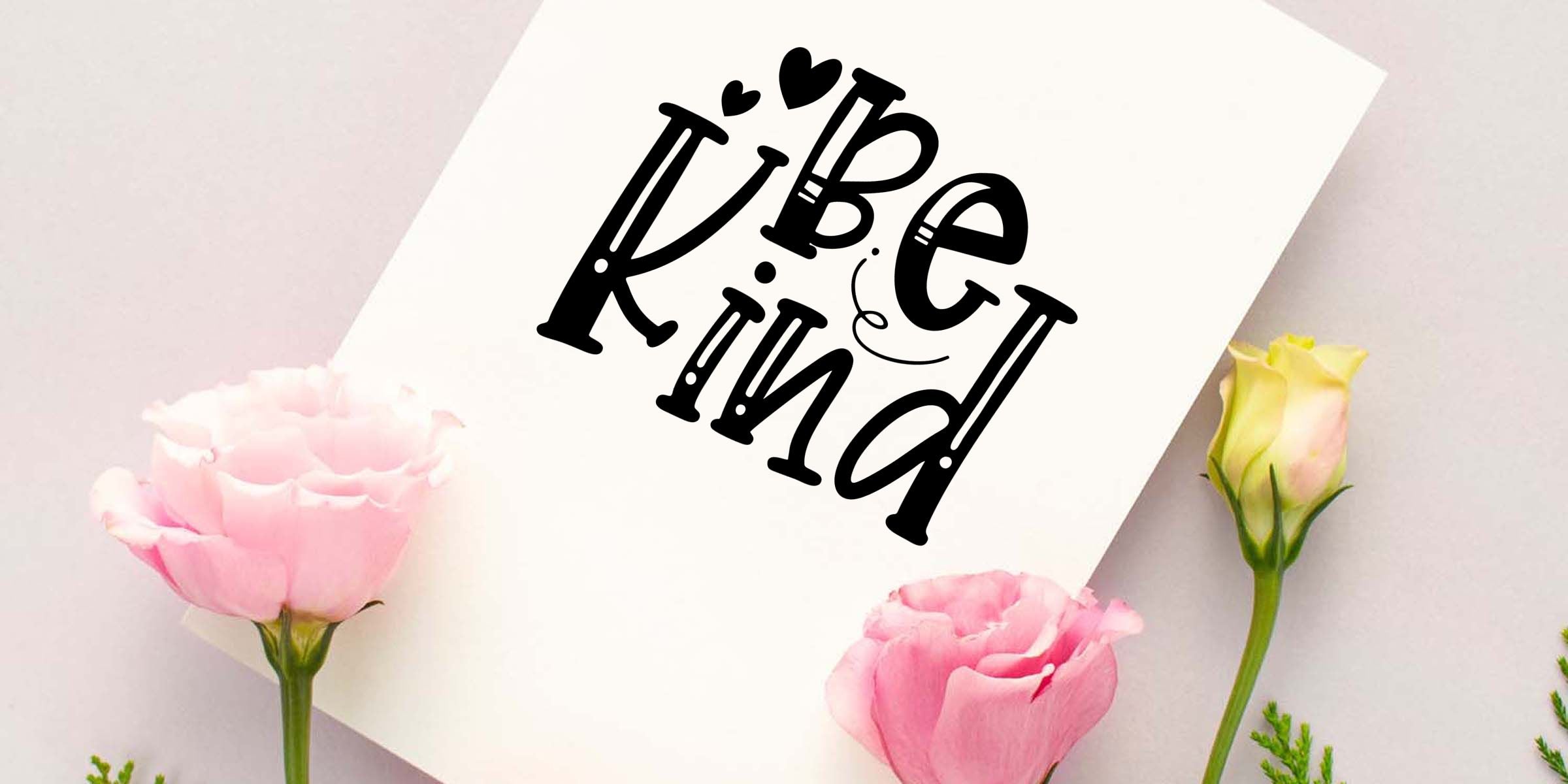 Elegant “Be Kind” typographic card with pink roses and soft pastel floral decor on a light background