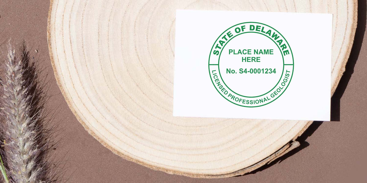 Delaware licensed Professional Geologist stamp on white card on wooden surface with dried grass, emphasizing Delaware Geologist Licensing.