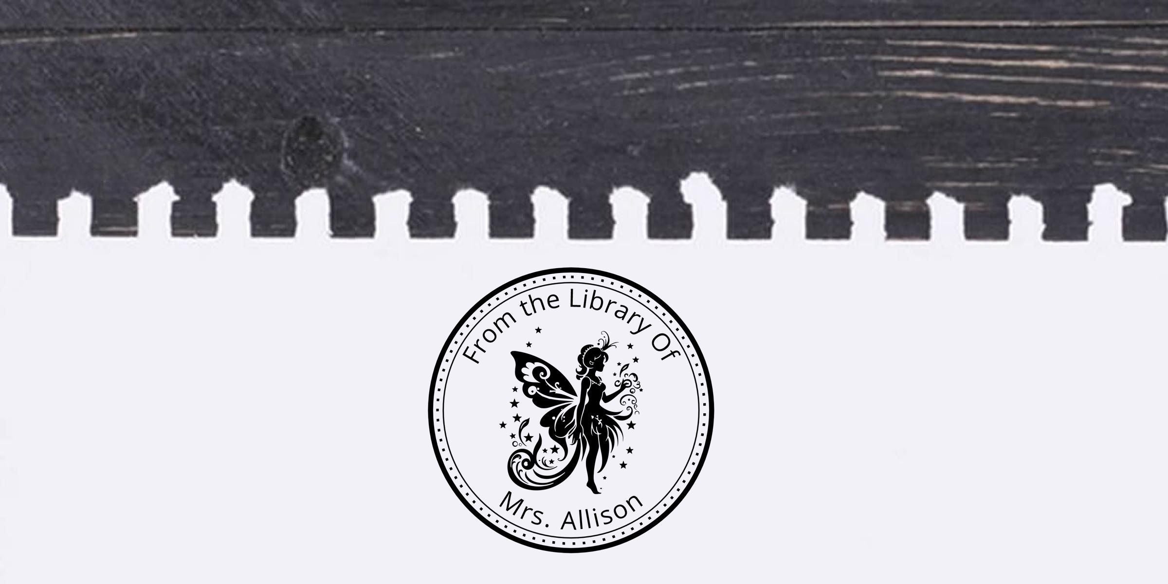 Custom library stamp on a black-and-white spiral notebook page reading “From the Library of Mrs. Allison” with a fairy silhouette emblem.