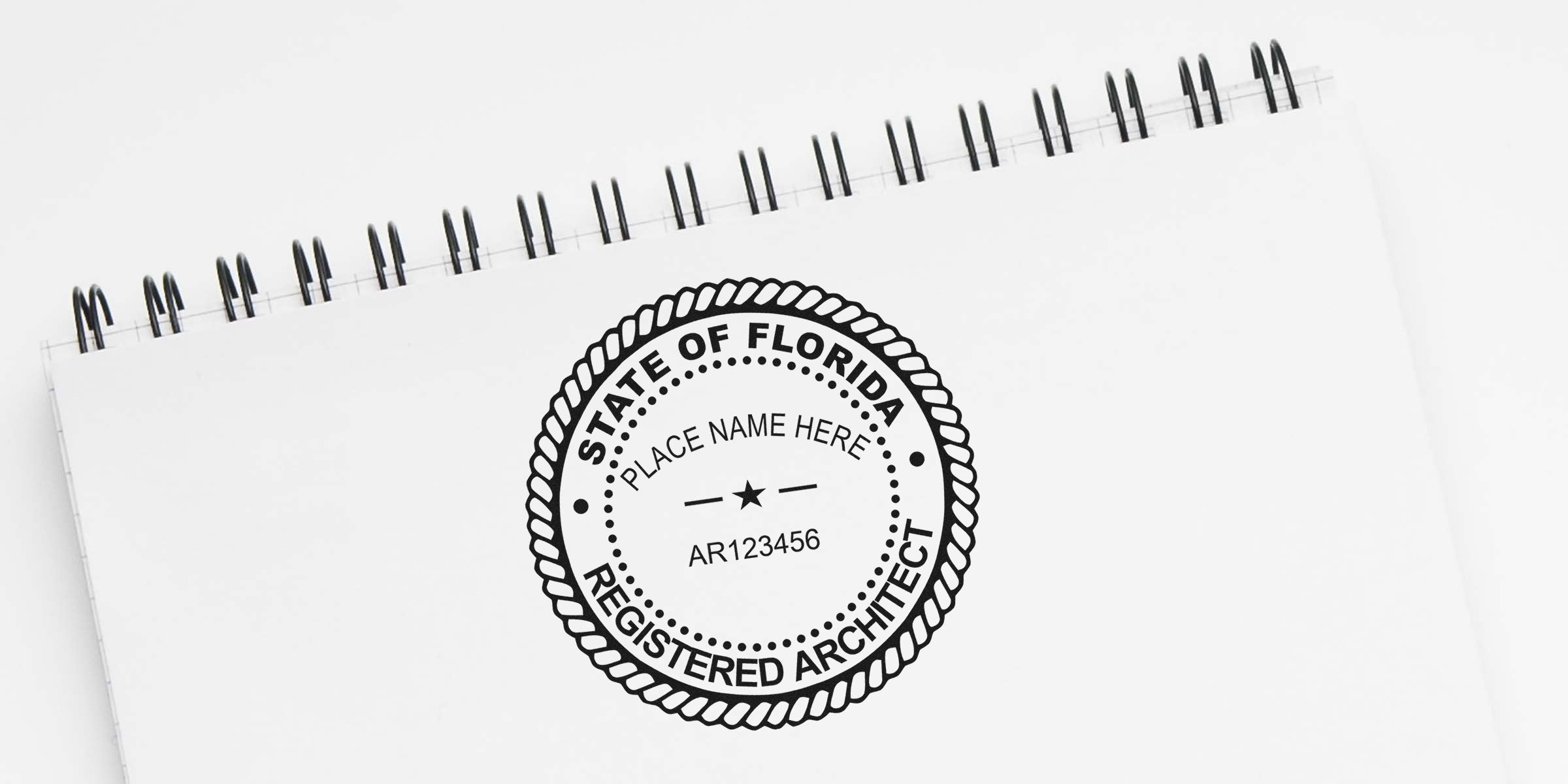 Florida architect seal stamped on white spiral notebook, showing guidelines for professional license verification.