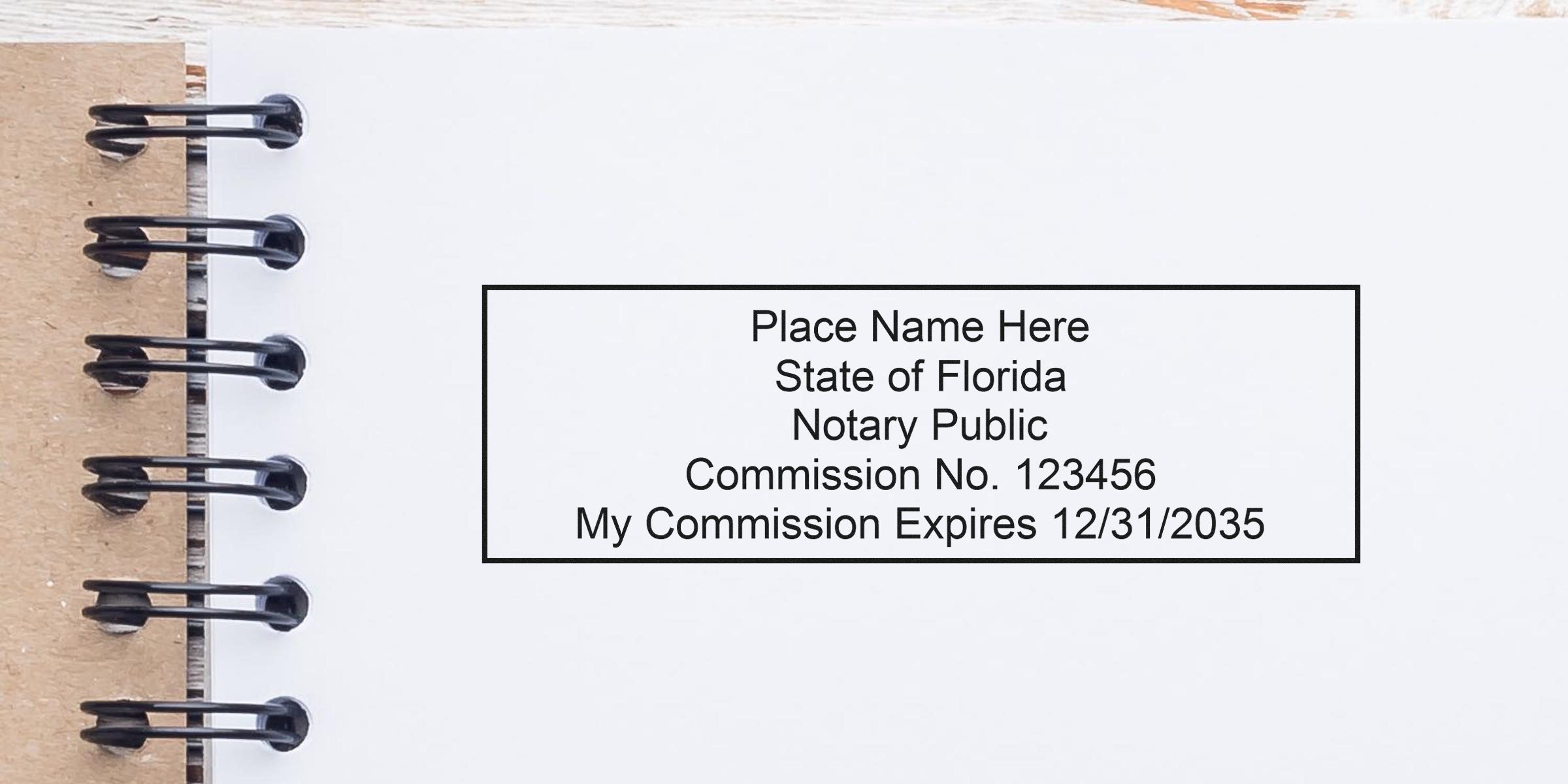 Florida Notary Seal stamp with expiration date on a spiral notebook page. Buy your Florida Notary Seal today.