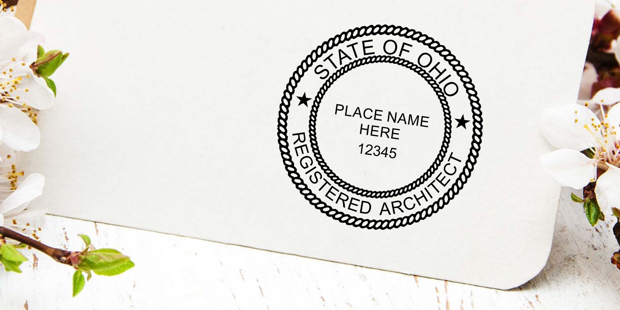 Custom State of Ohio registered architect stamp with place name and license number 12345 on a white card with floral accents