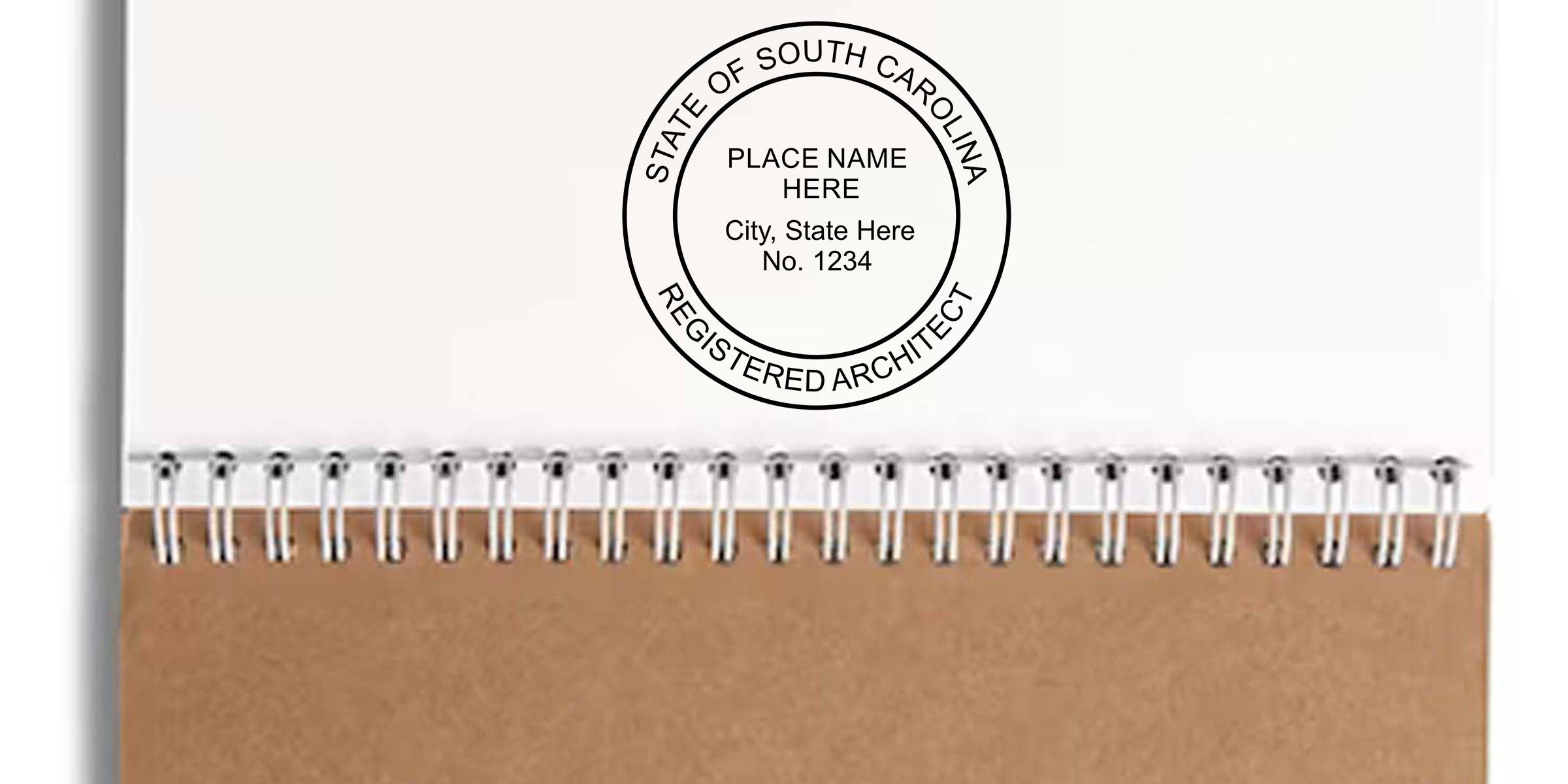 South Carolina Registered Architect seal on a spiral-bound notebook with white cover, brown kraft paper bottom, and placeholder text for place name, city, state, and license number 1234