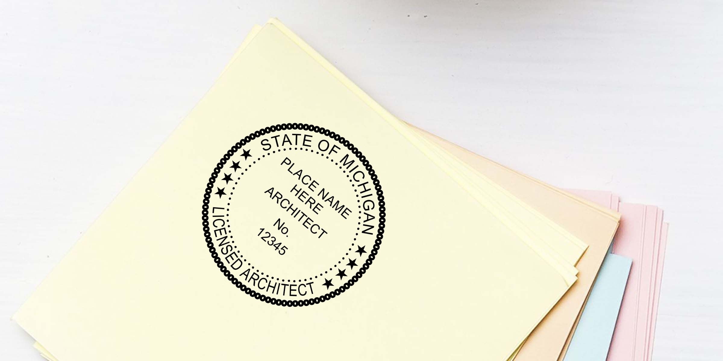 Stack of pastel document folders featuring a Michigan licensed architect seal and sample architect number on the cover