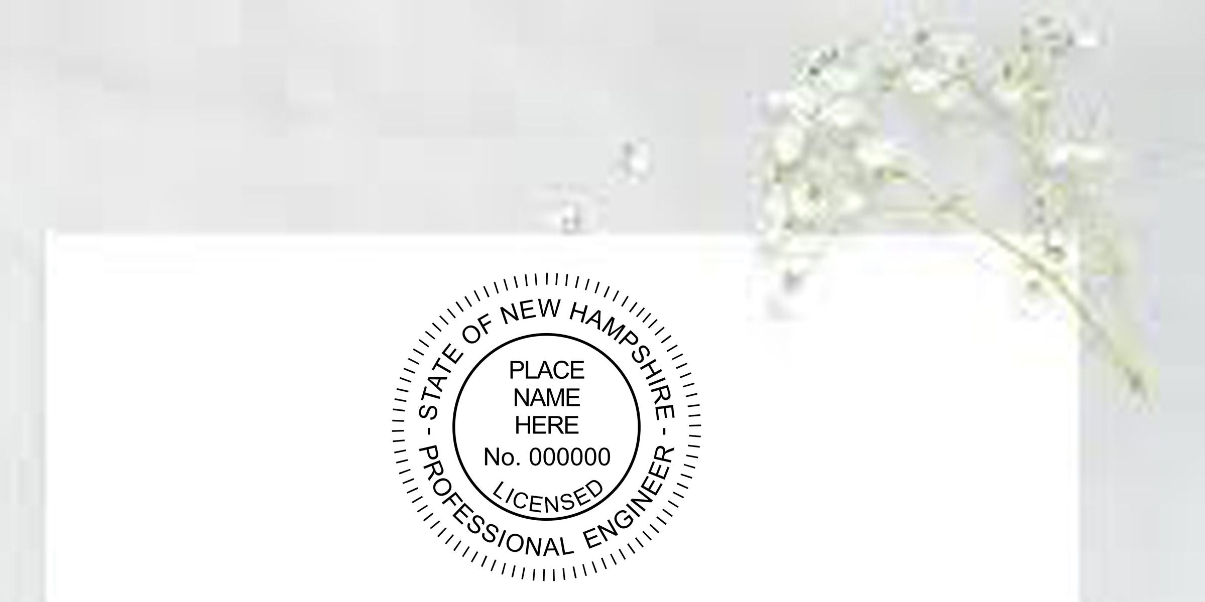 White envelope with New Hampshire licensed professional engineer seal stamp and place name placeholder beside white floral arrangement