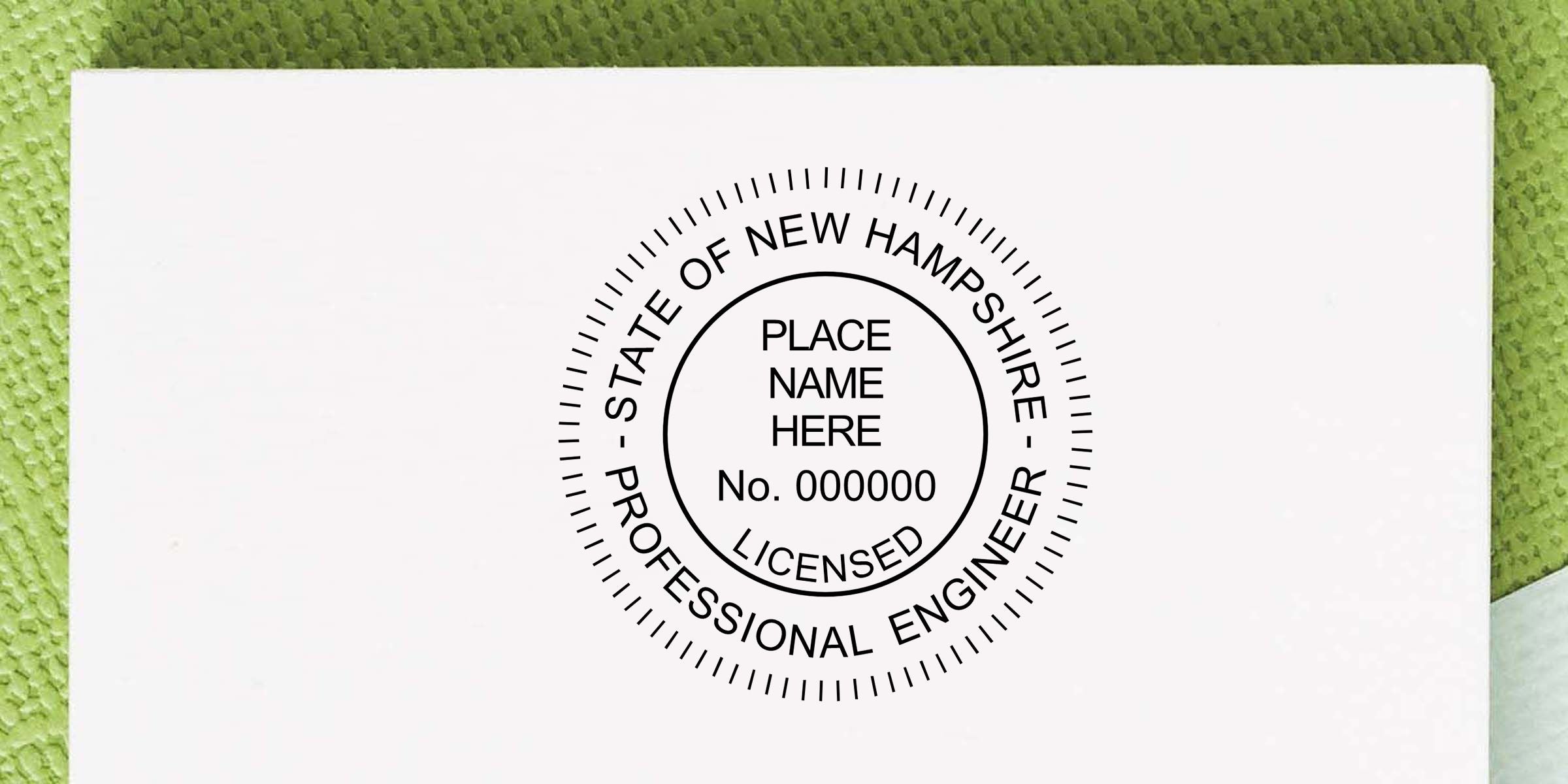 White New Hampshire Professional Engineer license seal with place name placeholder and license number on a document against a green textured background