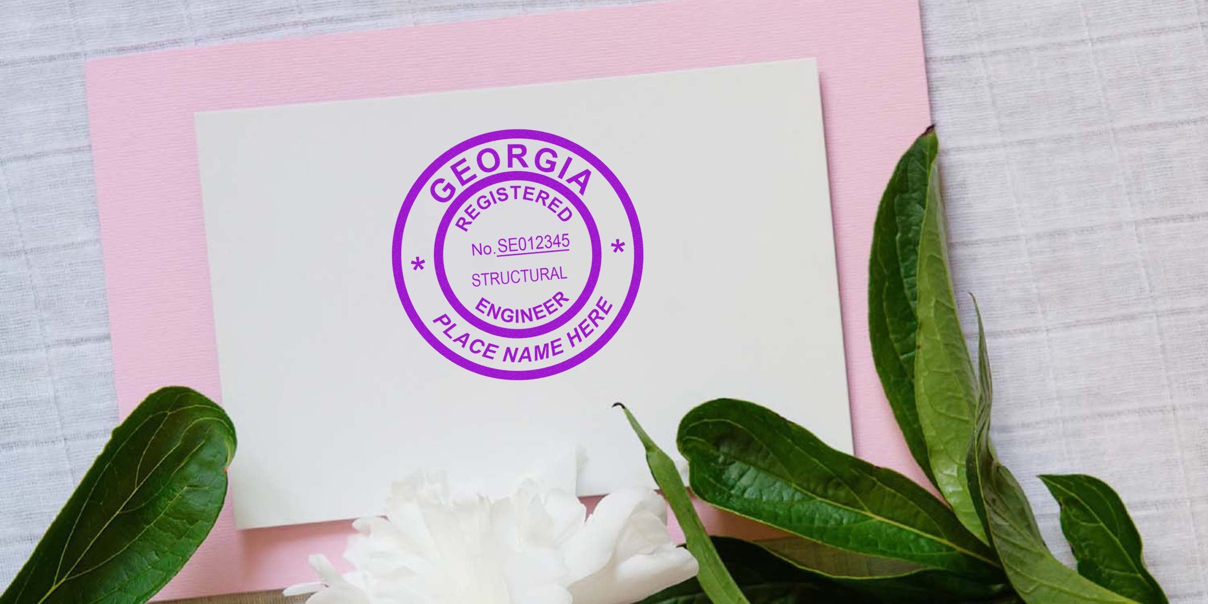 Engineer Seal Georgia on white paper with Georgia Engineering License stamp, framed by green leaves against a pink background.