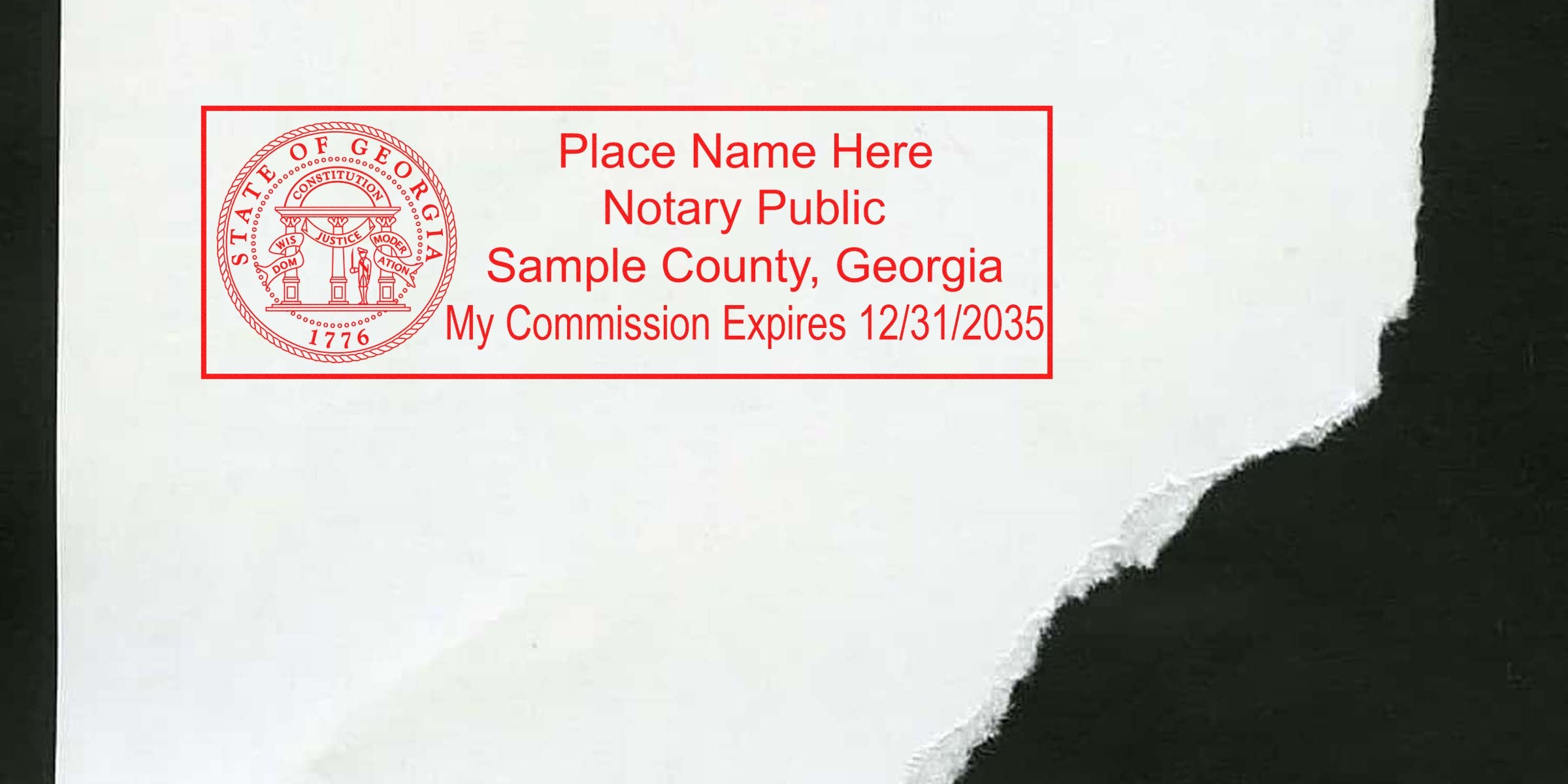 Georgia notary public stamp with commission expiration date on torn paper, part of Georgia Notary Kit and Starter Kit.