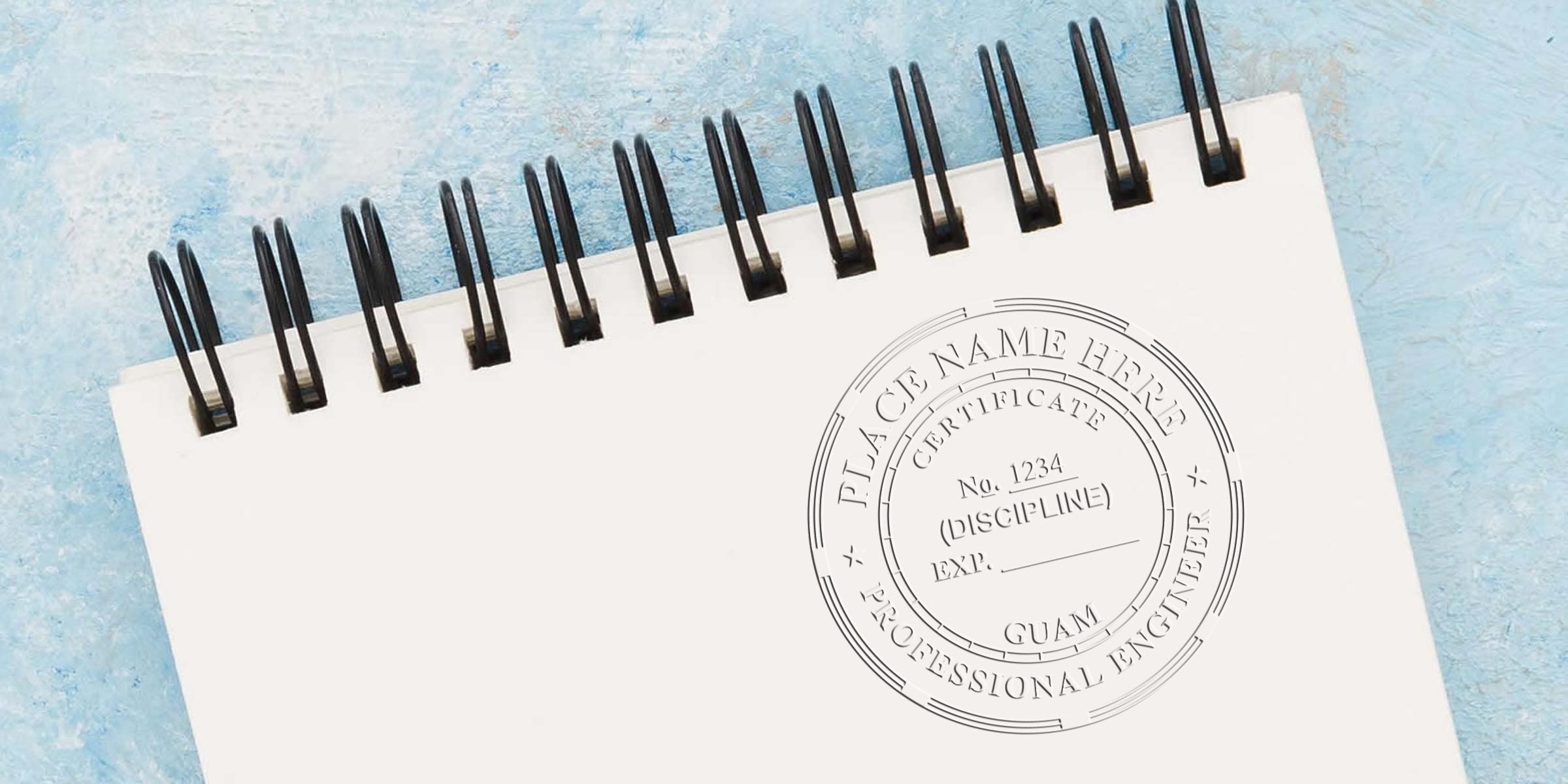 Professional Engineer Seals on a white spiral notebook, symbolizing Guam Engineering Services certification and licensing.