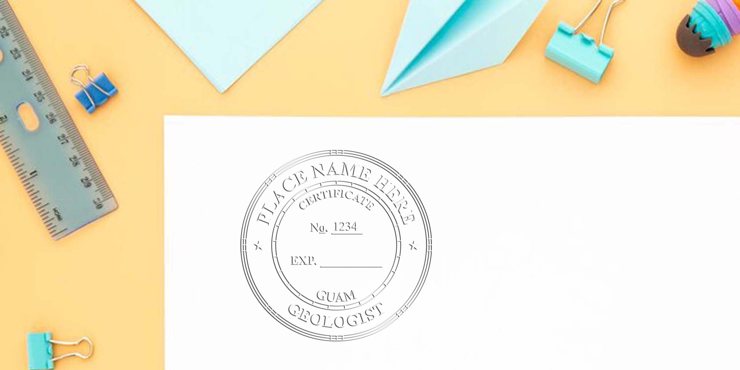 Guam Geologist Seal stamp on white paper with office supplies and ruler on yellow background, symbolizing geological certification in Guam.