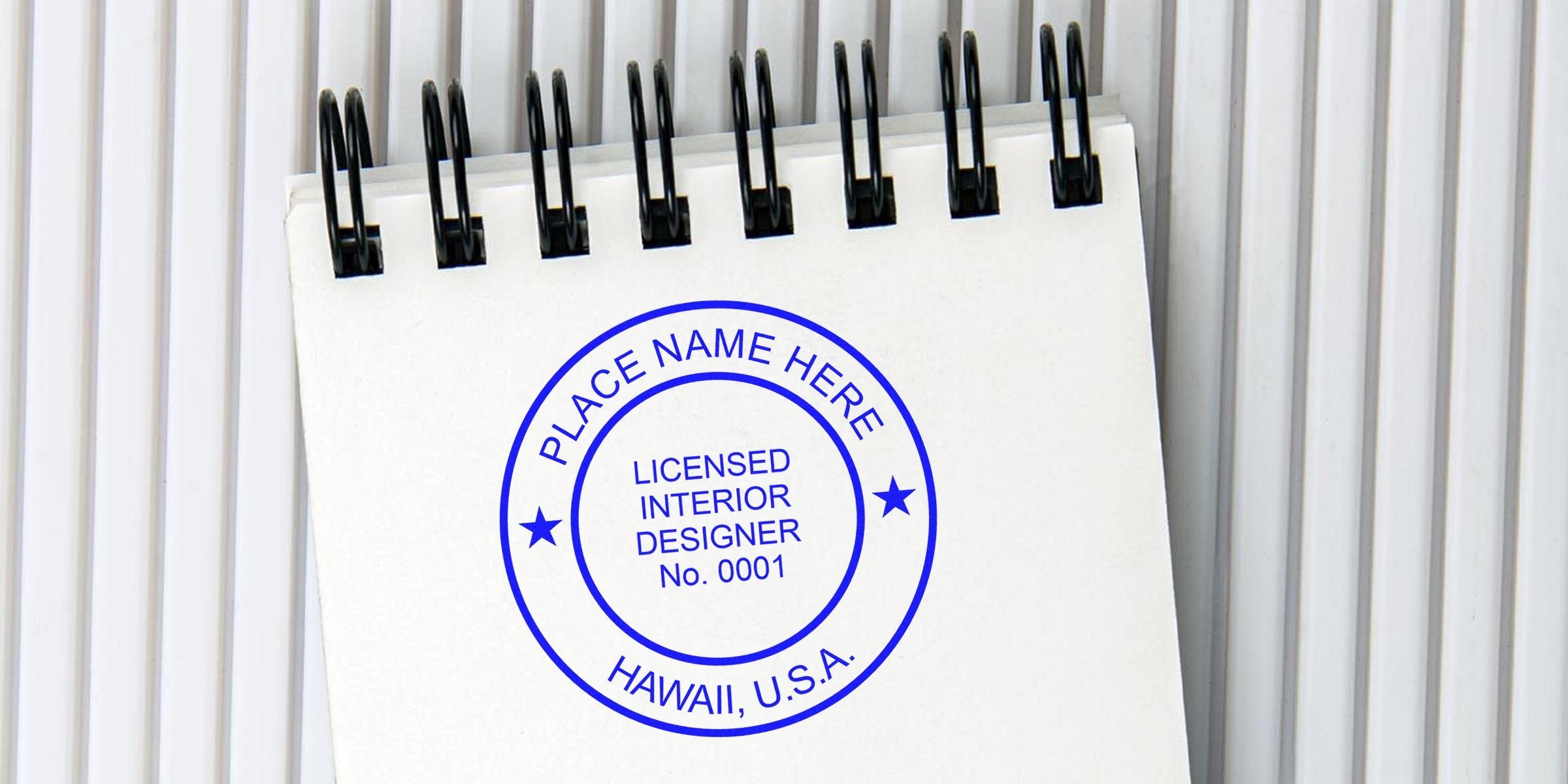 Spiral notebook with licensed interior designer stamp showing Hawaii, USA, highlighting Hawaii interior design rules and seal size requirements.
