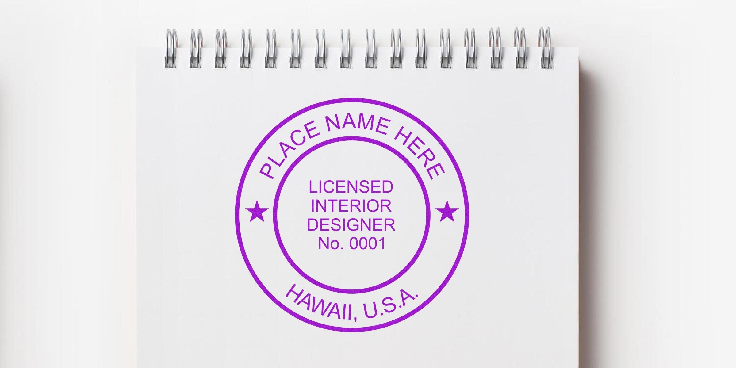 Licensed interior designer stamp on white spiral notebook, Hawaii USA certification seal, meeting Hawaii interior design regulations and certification standards.