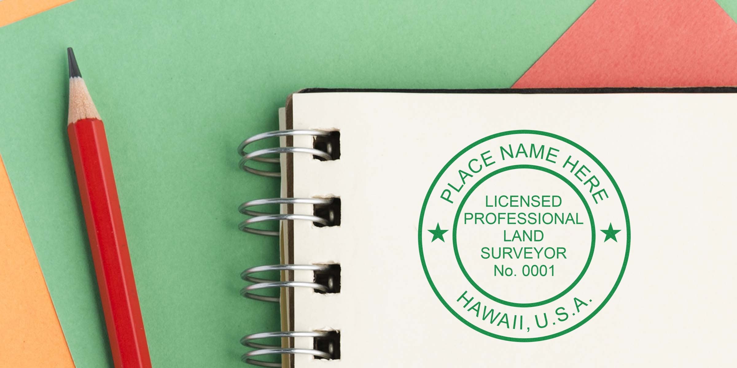 Red pencil next to a spiral notebook with a Hawaii land surveyor seal and an embosser stamp for a licensed Hawaii professional, USA.