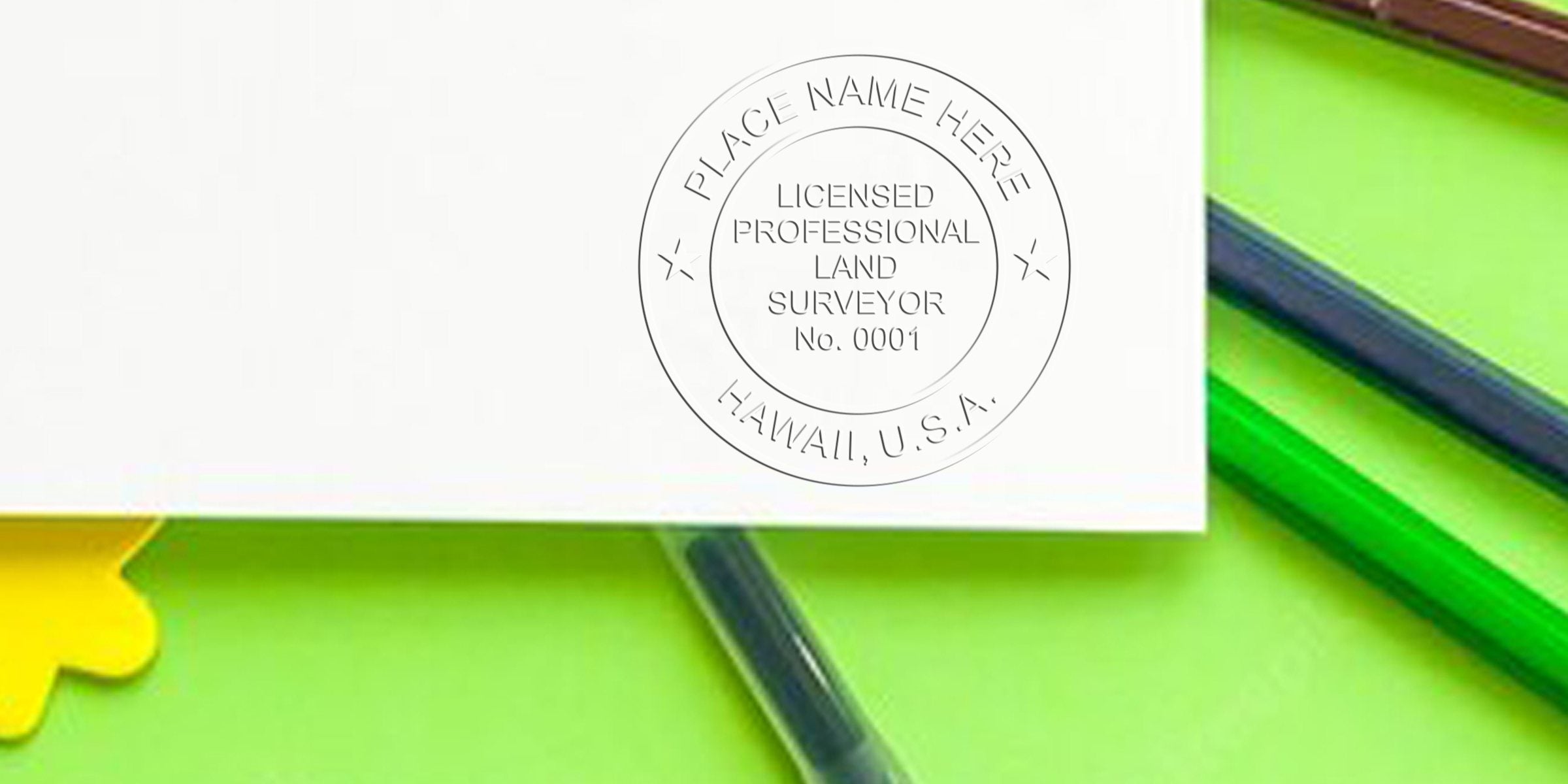Hawaii land surveyor seal stamped on white paper, surrounded by green and yellow office supplies, highlighting land surveyor certification in Hawaii.