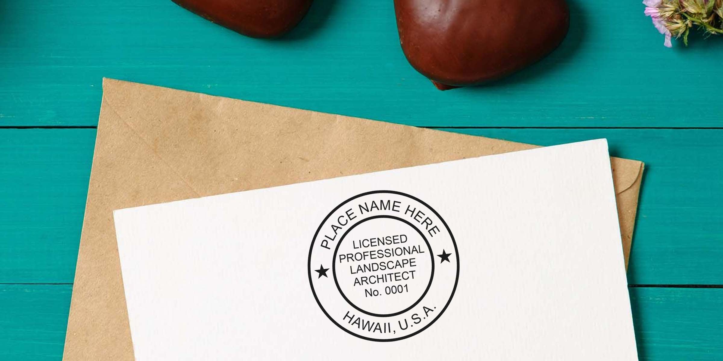 Licensed Hawaii landscape architect stamp on white paper with envelope, set on teal wooden background, showcasing seal and documentation tips.